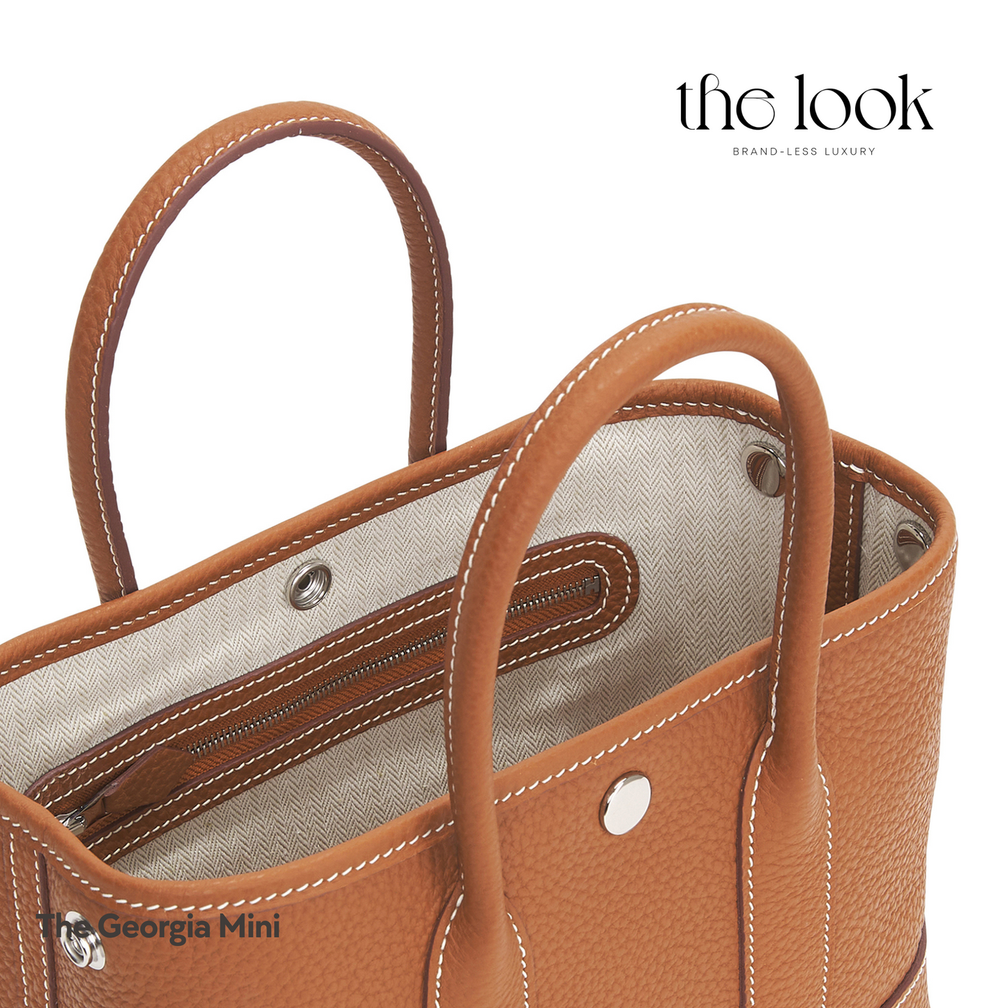 Close-up of Georgia Mini Tote in Gold Tan Pebbled Calfskin Leather with visible stitching