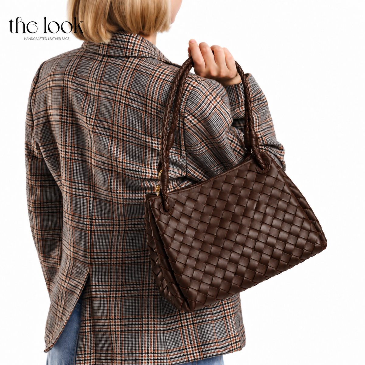 Ebene The Loop Medium Parachute Convertible Shoulder Bag woven lambskin leather bag carried over the shoulder with a plaid blazer | The Look Officiel