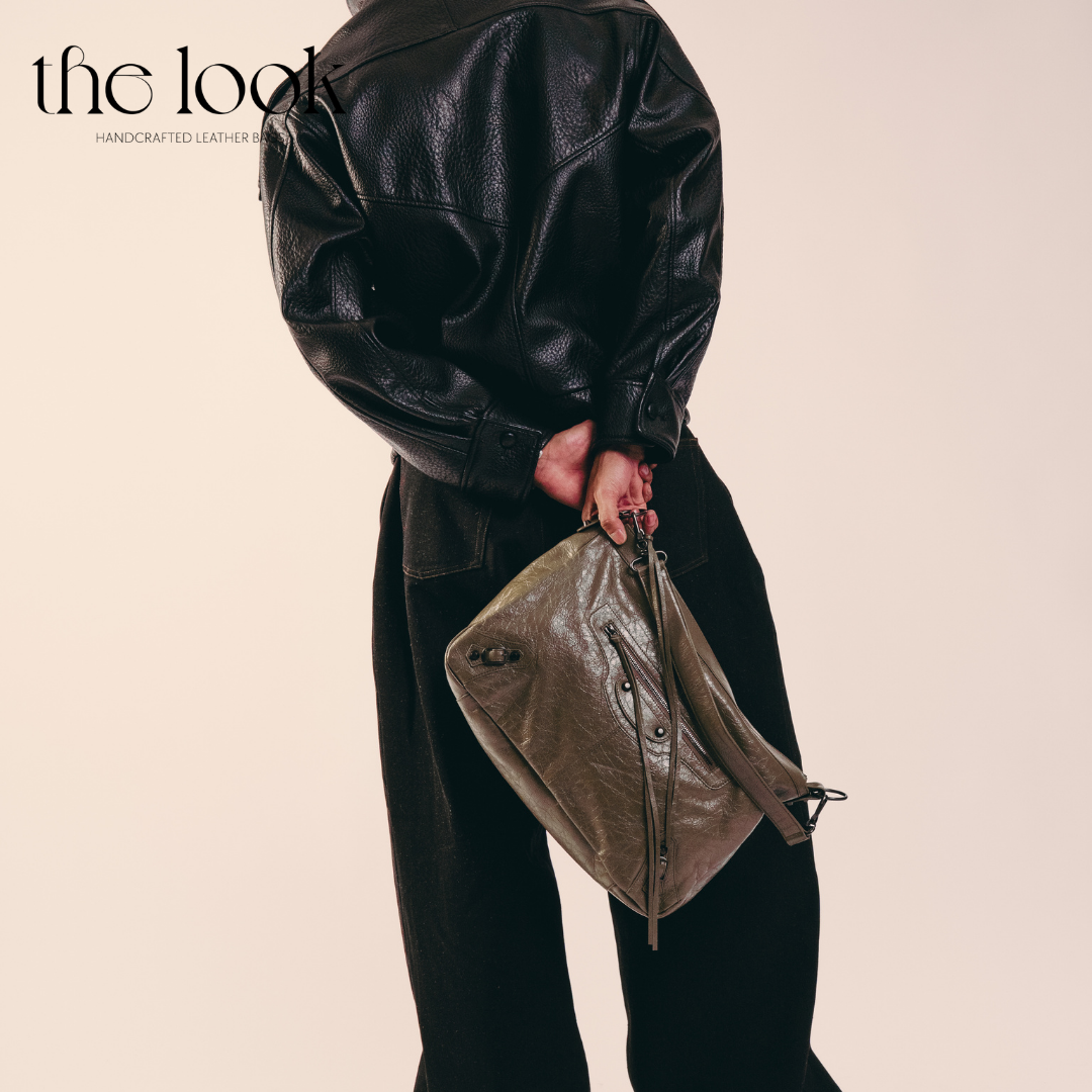 model holding Biker Convertible shoulder bag olive goatskin handle front view