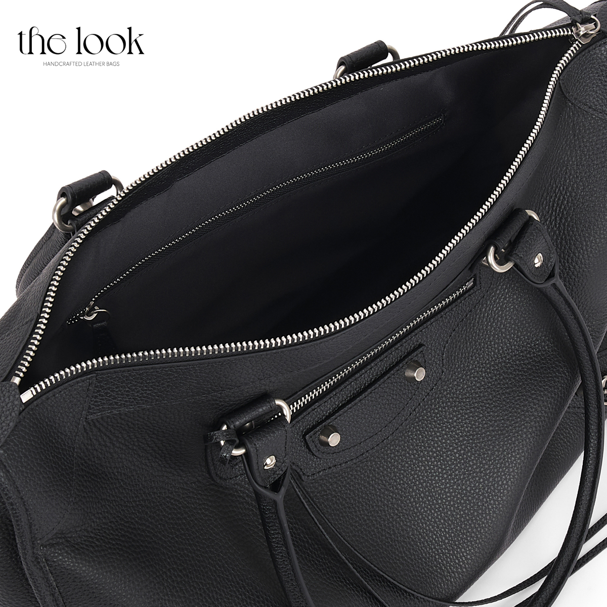 Open Black Biker Extra Tote showing canvas-lined interior and interior zip pocket