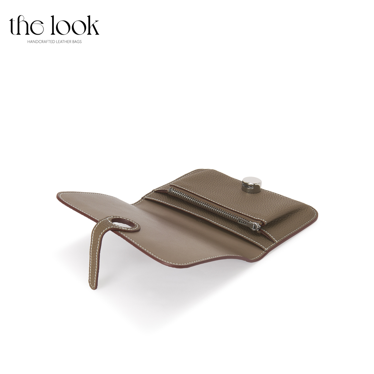 Cleo Small Wallet in Etoupe top-grain pebbled calfskin leather with stainless steel silver hardware, opened at an angle showing interior organization