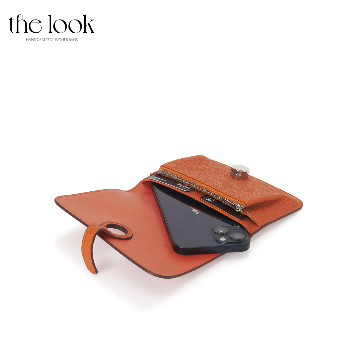 Cleo Small Wallet in Tangerine top-grain pebbled calfskin leather with stainless steel silver hardware, opened with cards and phone shown inside