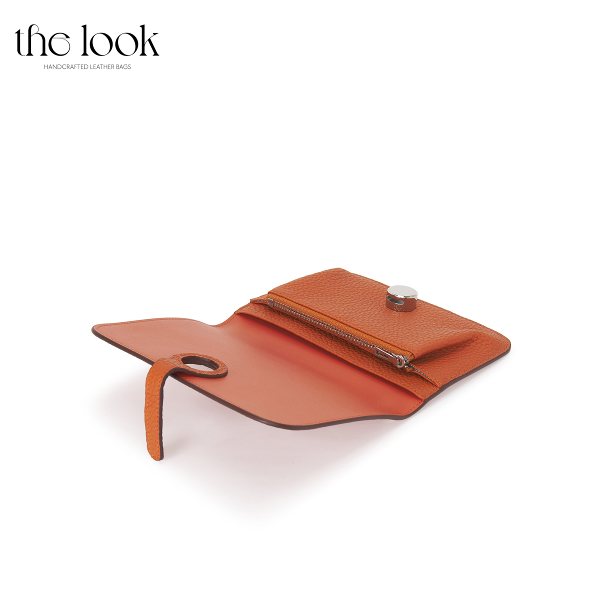 Cleo Small Wallet in Tangerine top-grain pebbled calfskin leather with stainless steel silver hardware, opened at an angle showing interior organization