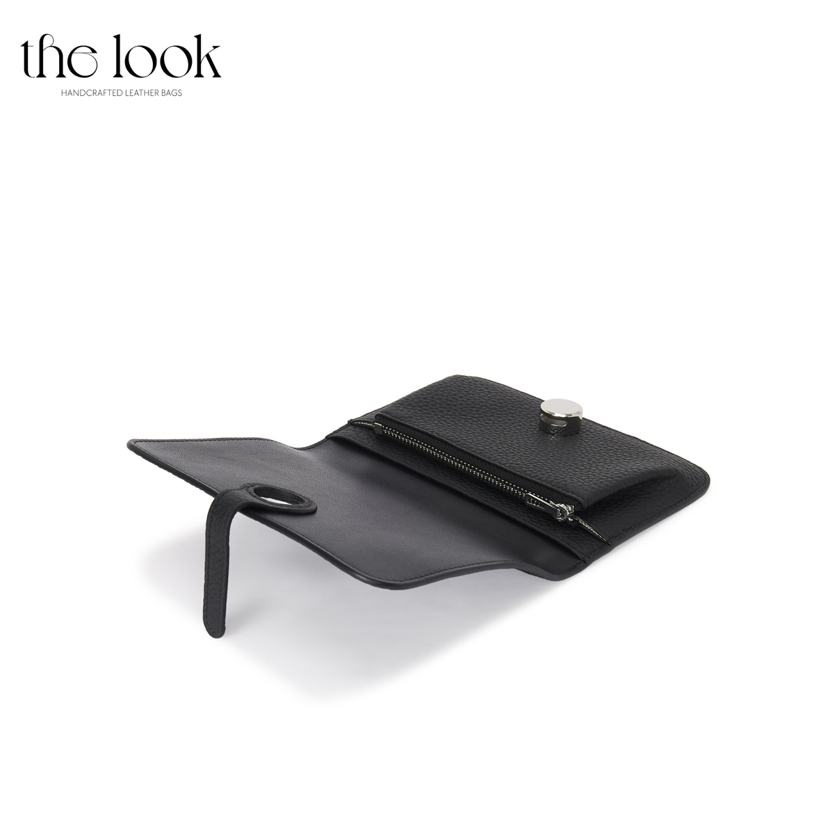 Cleo Small Wallet in Black top-grain pebbled calfskin leather with stainless steel silver hardware, opened at an angle showing interior organization