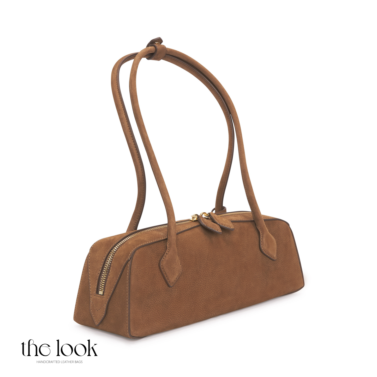Brown handbag with a strap on a white background | The Look Officiel