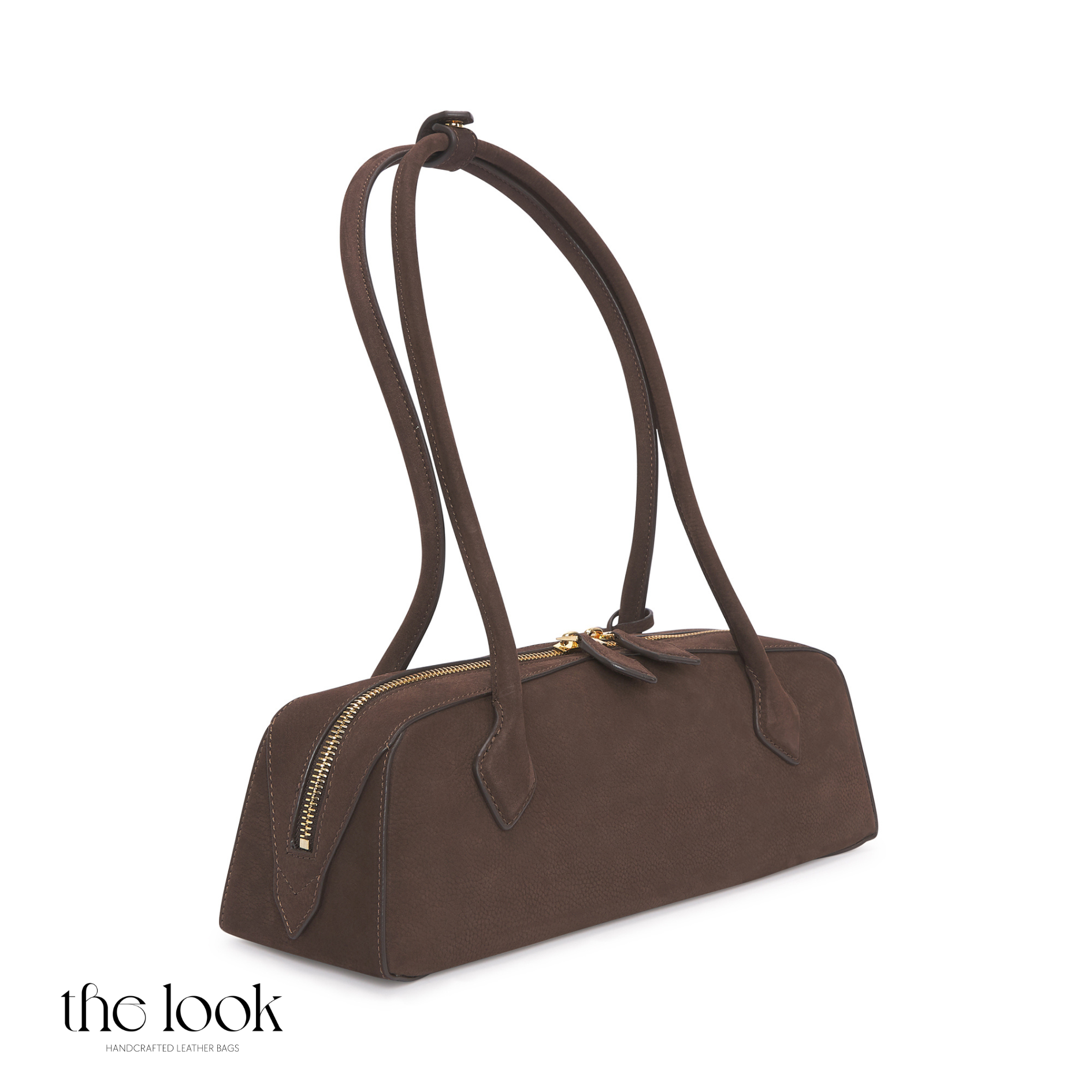 Brown handbag with a strap on a white background | The Look Officiel