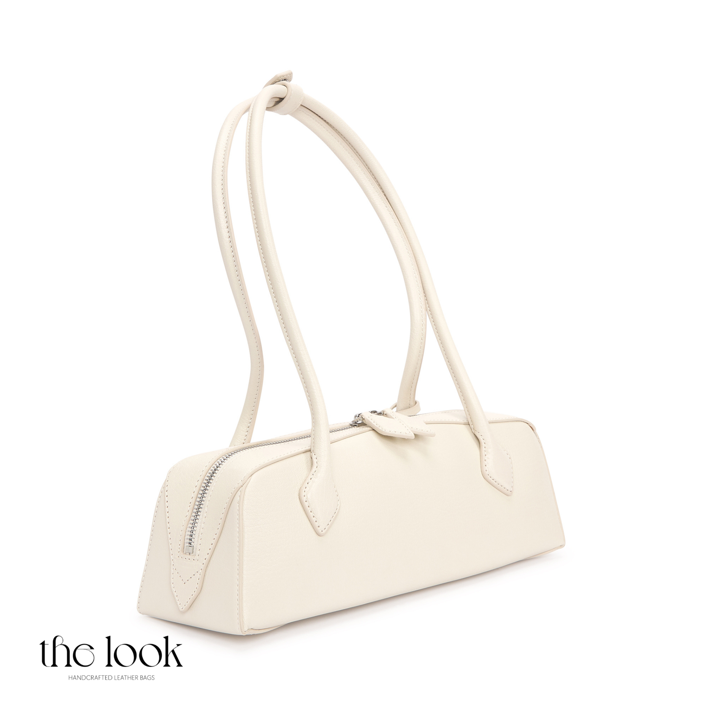 White handbag on a white background with 'the look' branding. | The Look Officiel