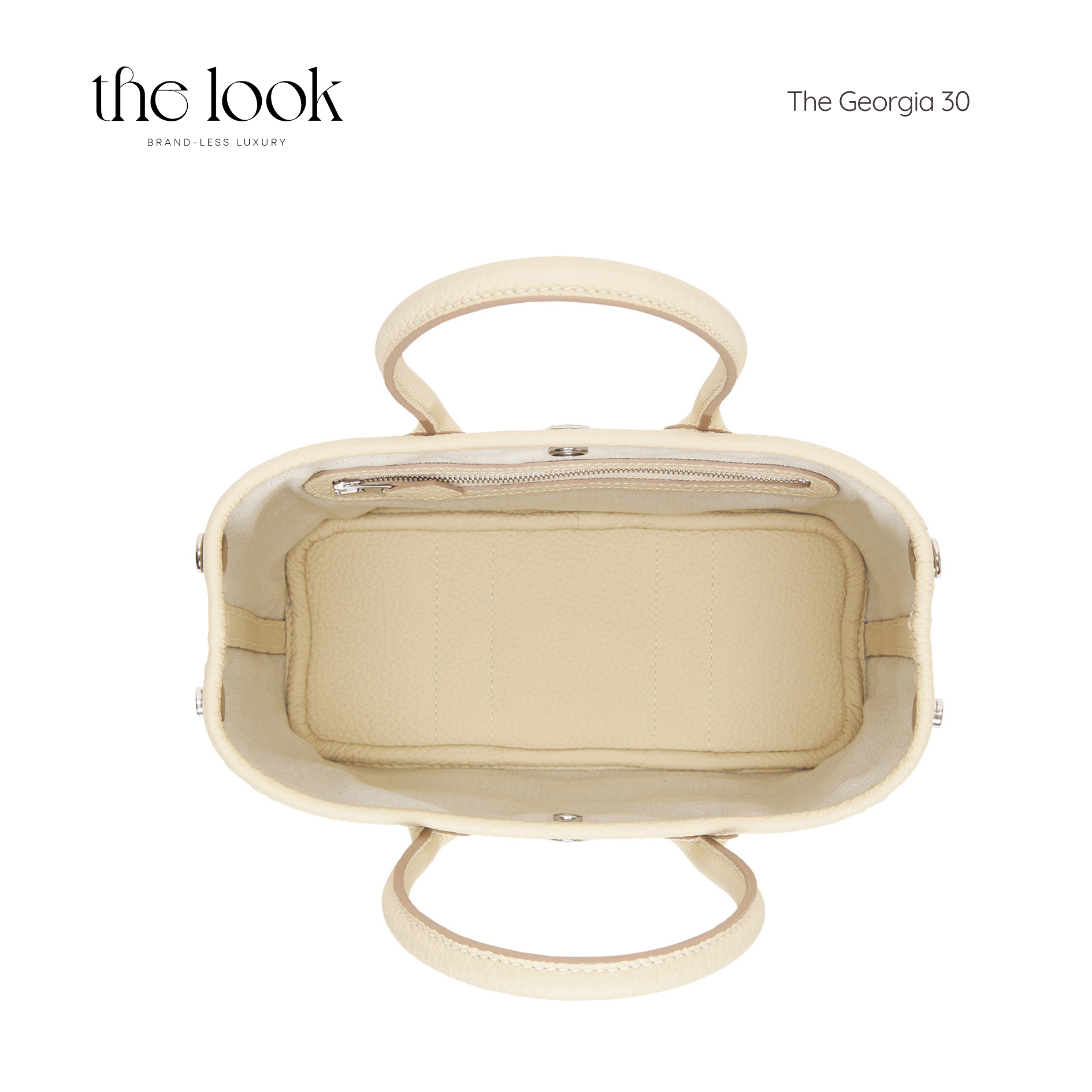 Interior view of Georgia Medium Tote in cream pebbled calfskin leather showcasing spacious design and zipper detail.