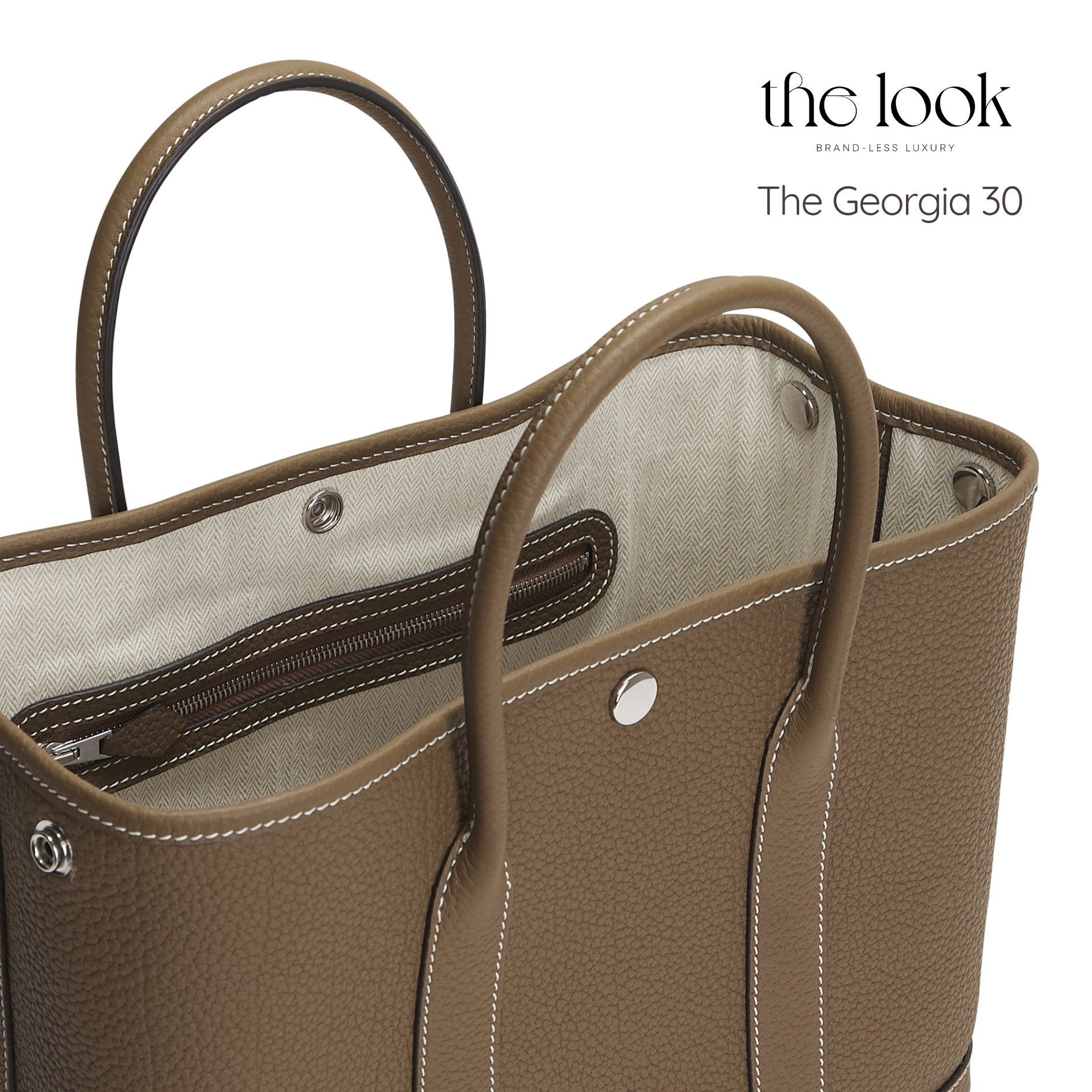 Brown handbag with visible stitching and interior lining on a white background, featuring 'the look' branding. | The Look Officiel