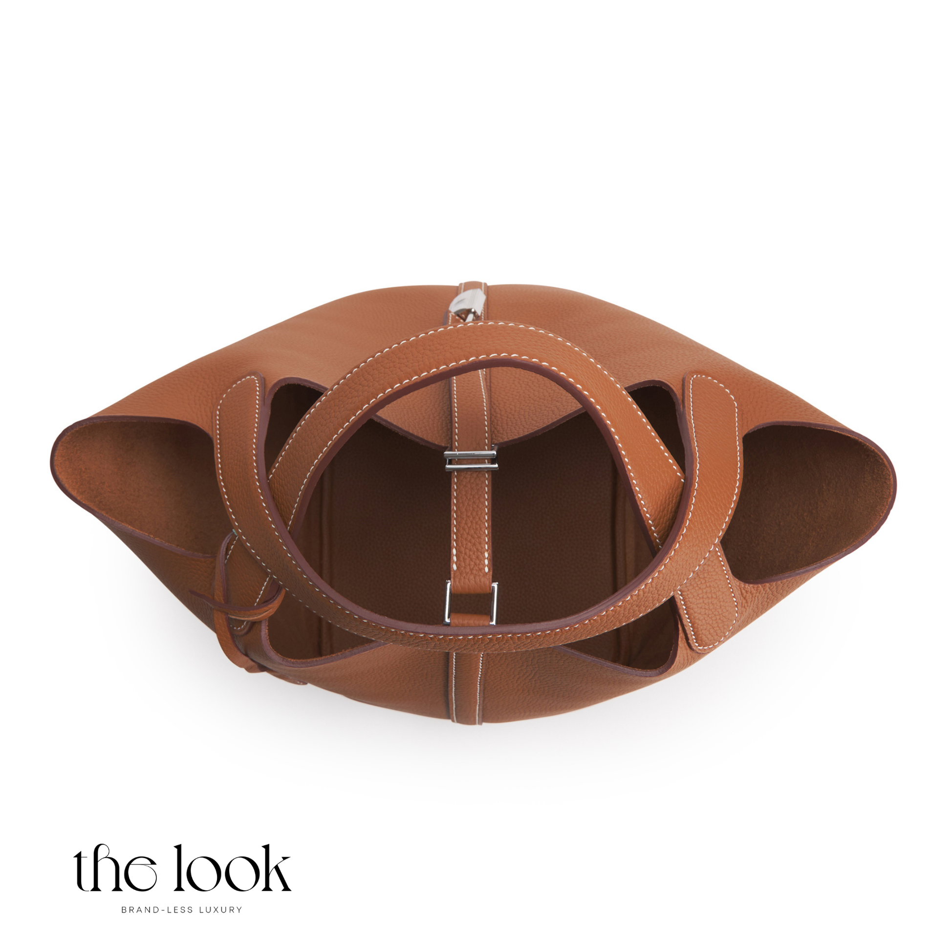 Brown leather handbag with circular design on a white background | The Look Officiel
