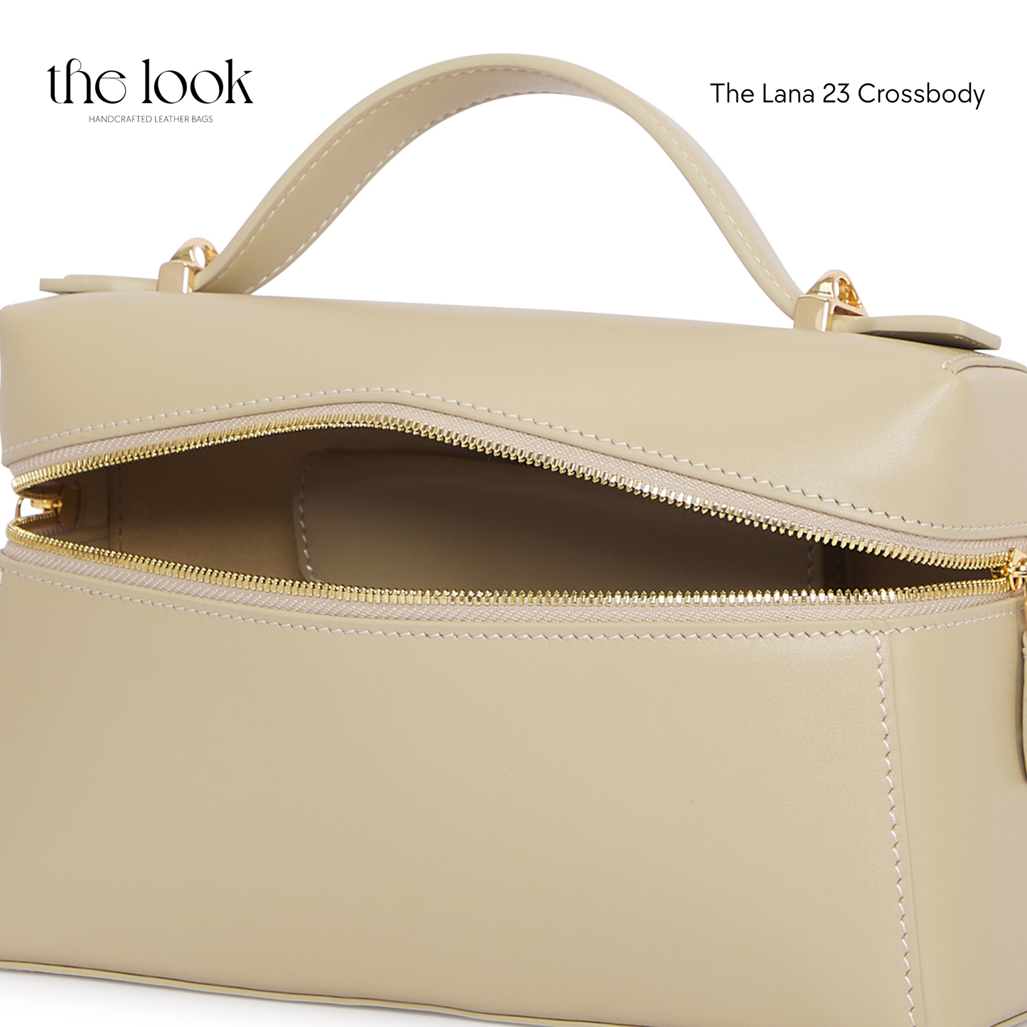 Beige handbag with gold zipper on a white background, featuring 'the look' brand. | The Look Officiel