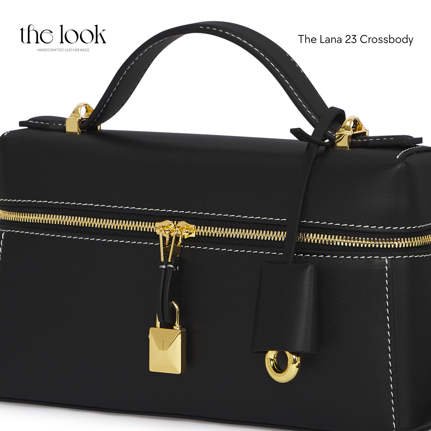 Black crossbody bag with gold accents on a white background | The Look Officiel
