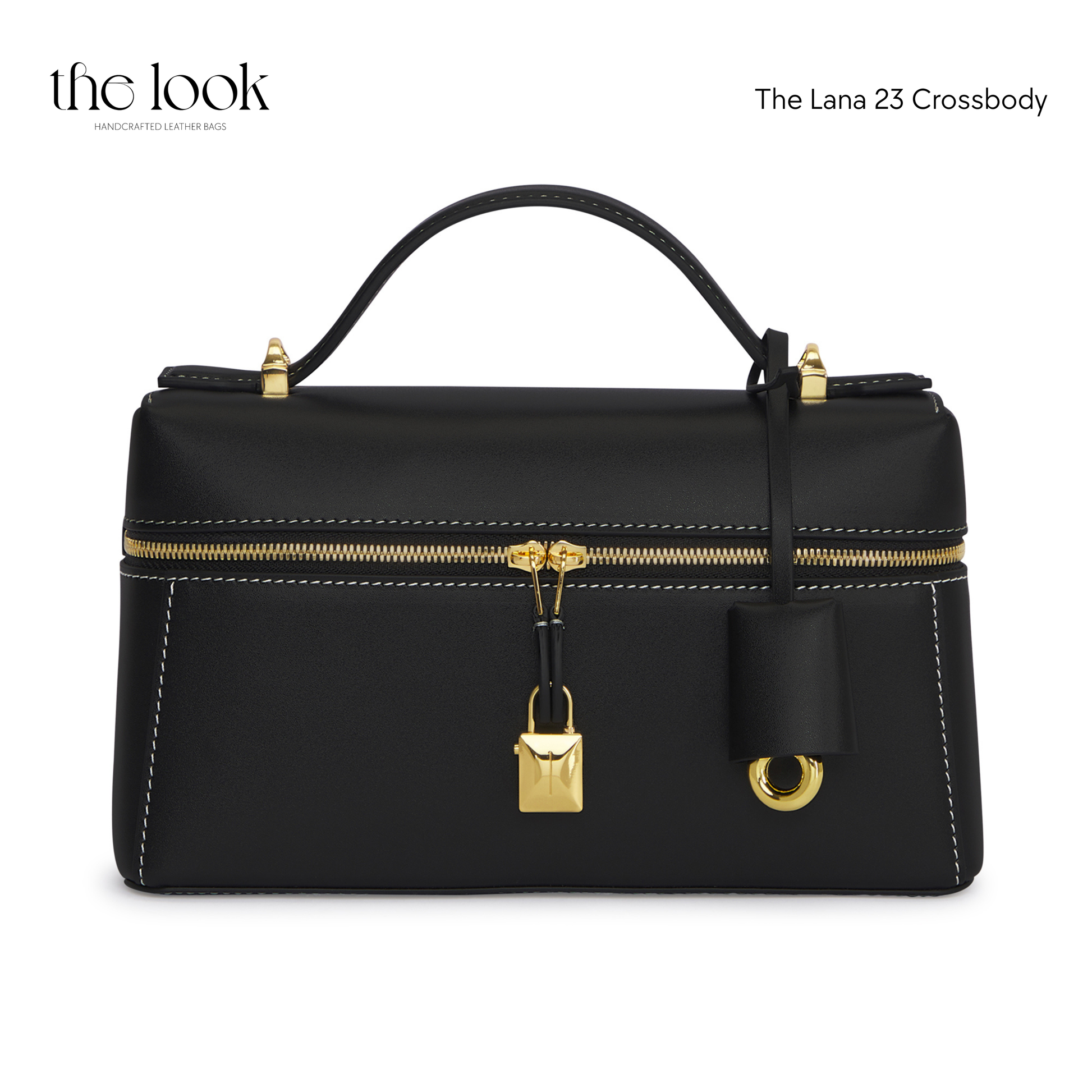 Black crossbody bag with gold accents on a white background | The Look Officiel