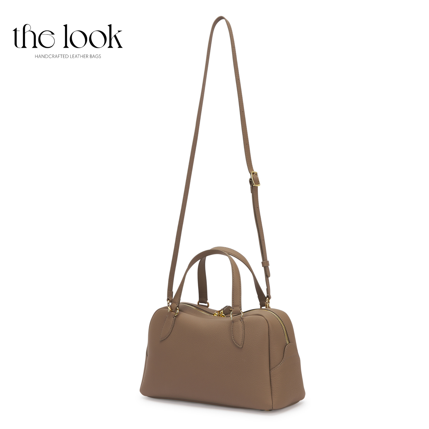 Brown handbag with a strap on a white background, branded 'the look'. | The Look Officiel