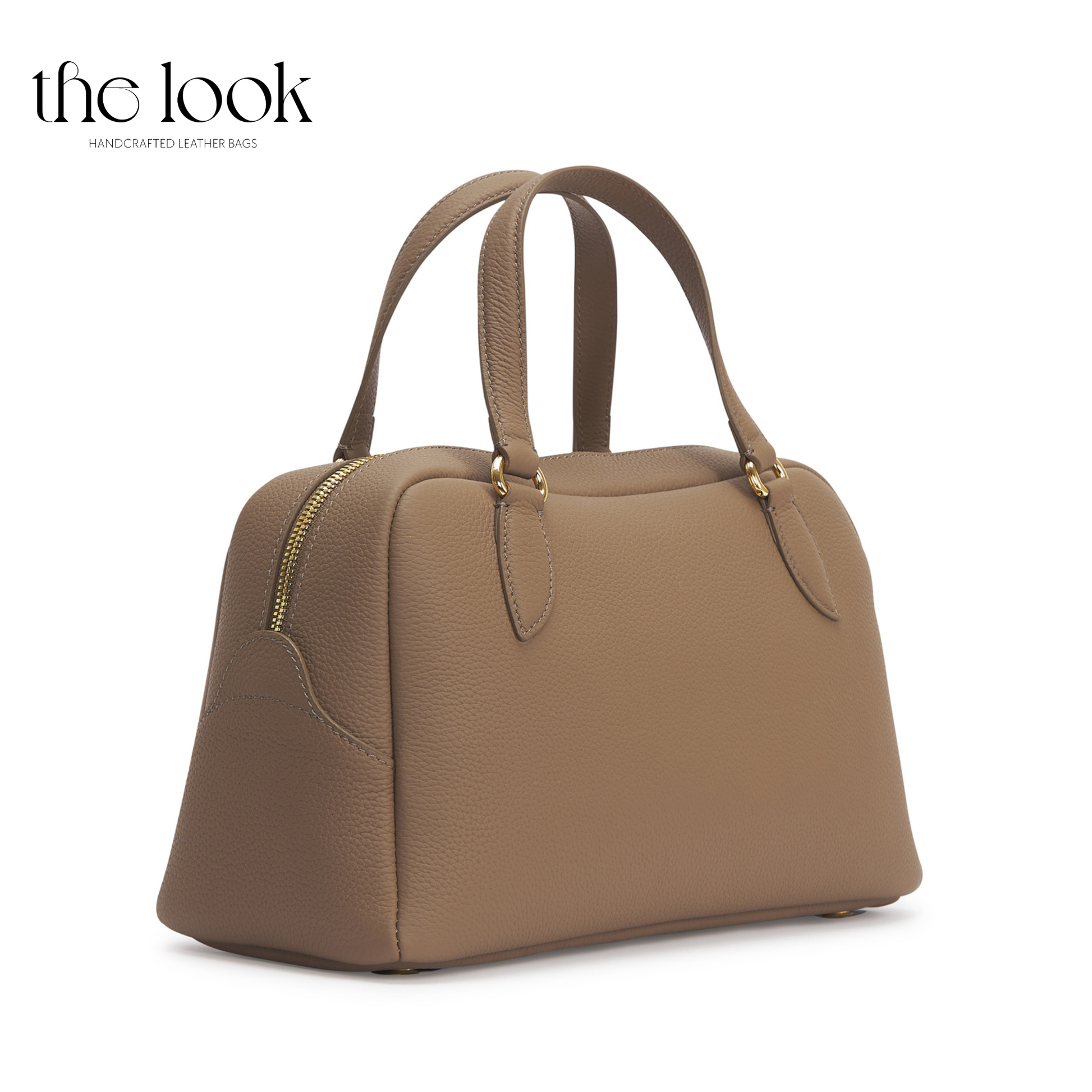 Brown handbag on a white background with 'the look' branding. | The Look Officiel
