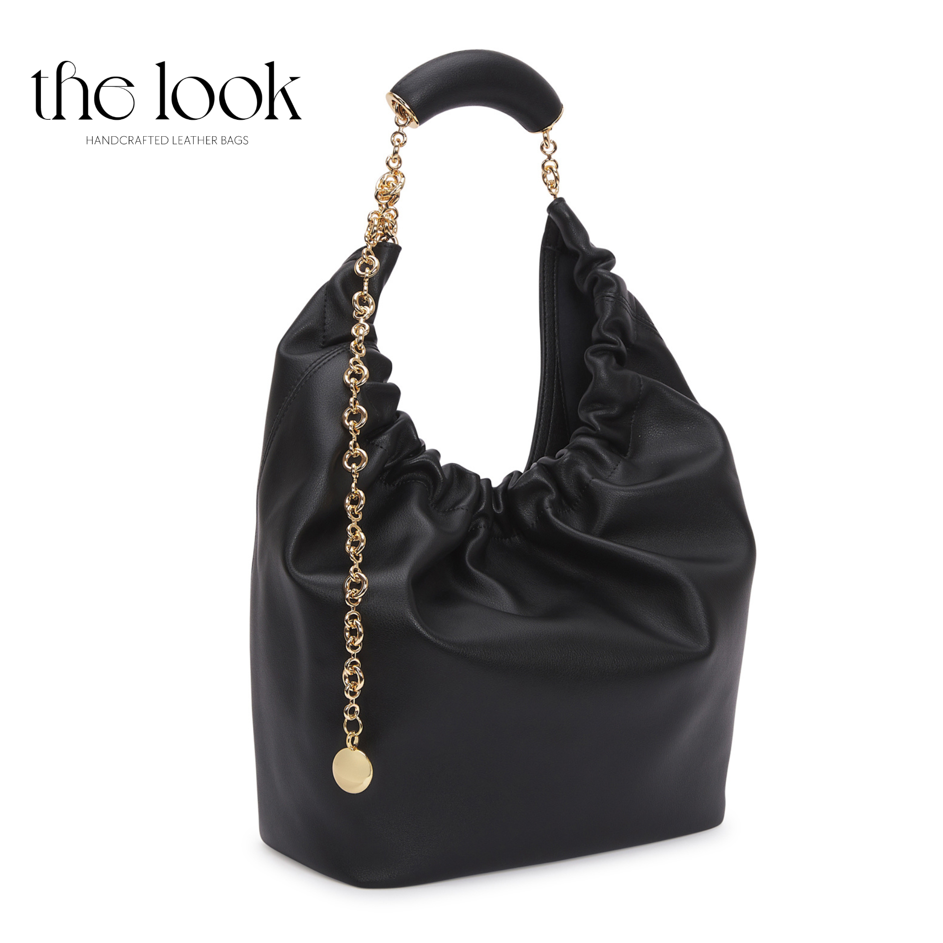 Black handbag with gold chain and handle on a white background, branded 'the look'. | The Look Officiel