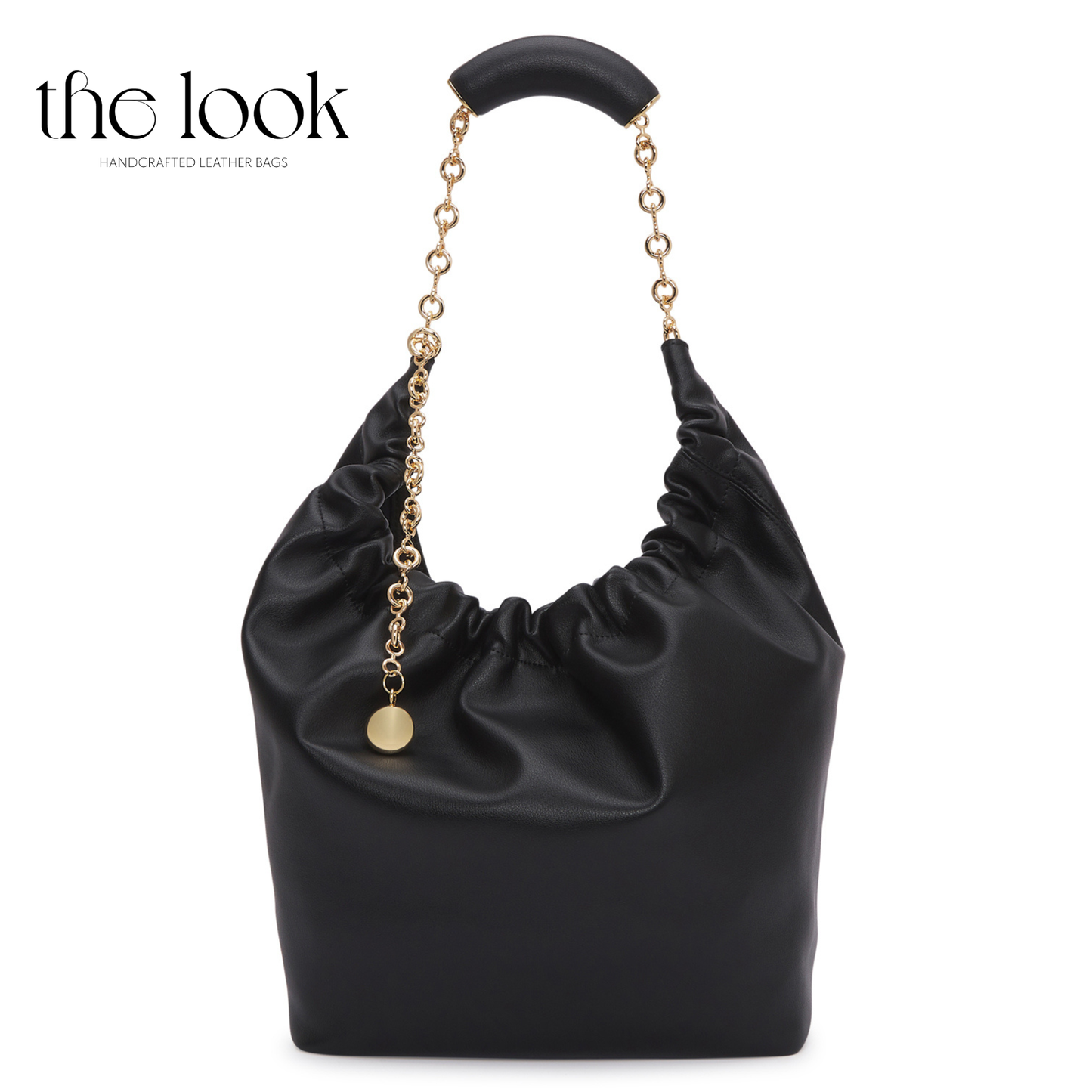 Black handbag with gold chain handle on a white background, branded 'the look' | The Look Officiel
