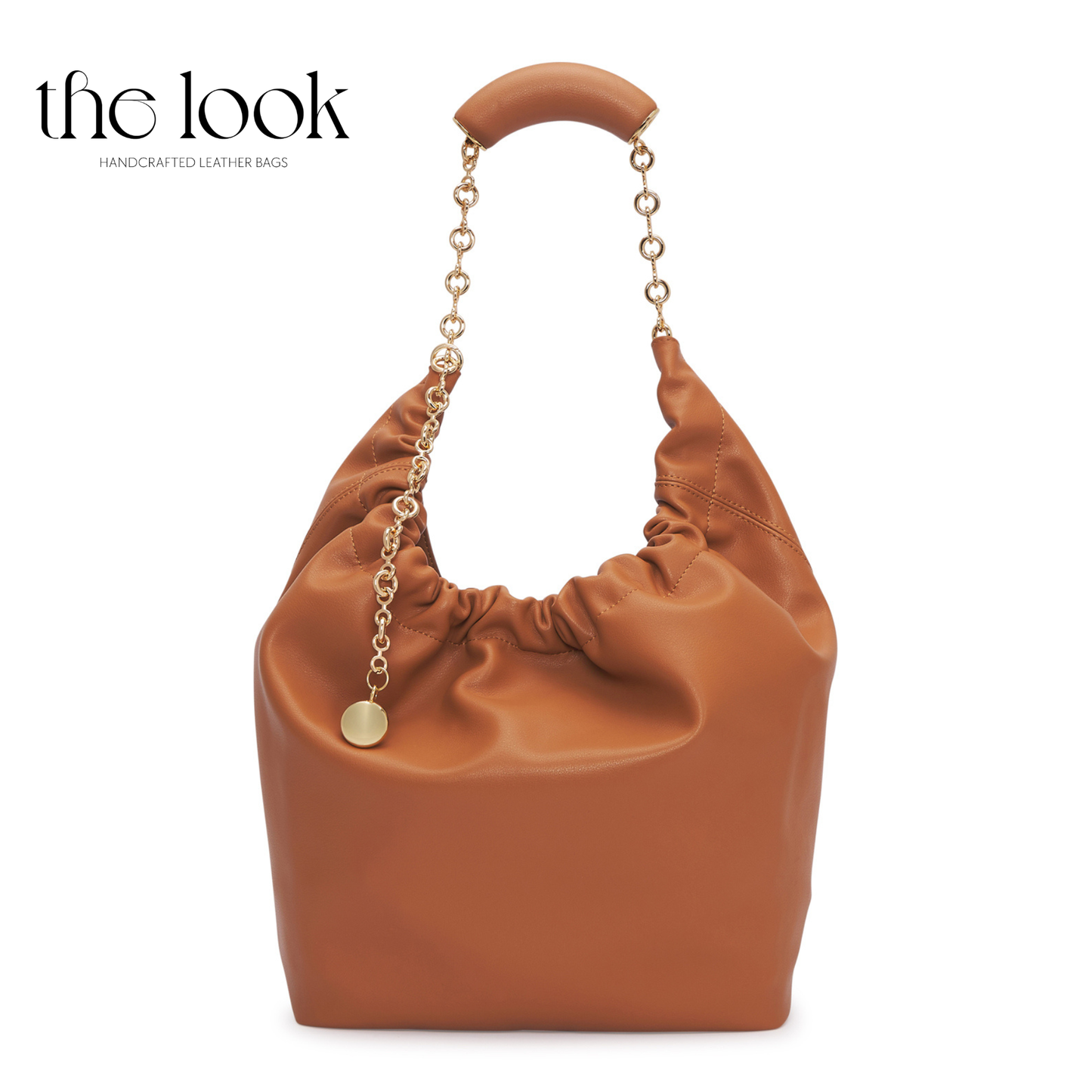 Brown leather handbag with gold chain handle on a white background, branded 'the look'. | The Look Officiel