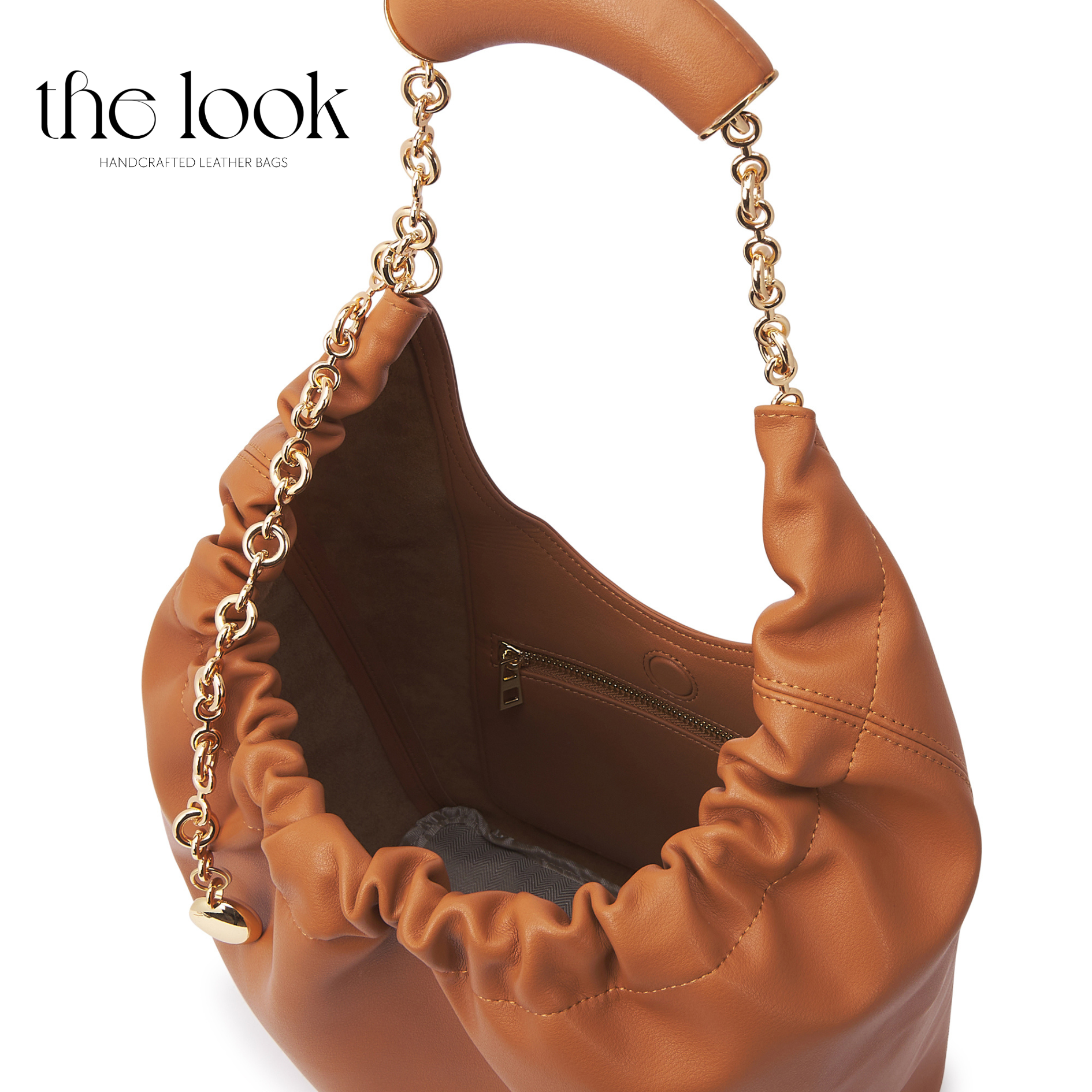 Brown leather handbag with gold chain handle on a white background, featuring 'the look' brand. | The Look Officiel