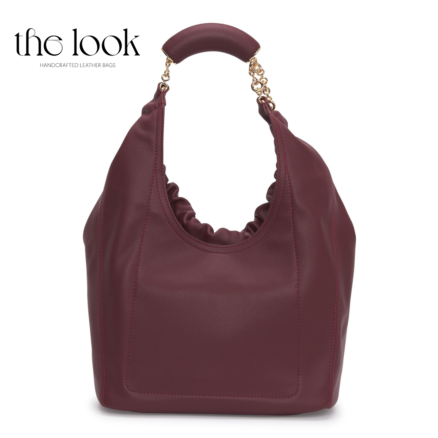 Maroon handbag with gold handle on a white background, branded 'the look'. | The Look Officiel