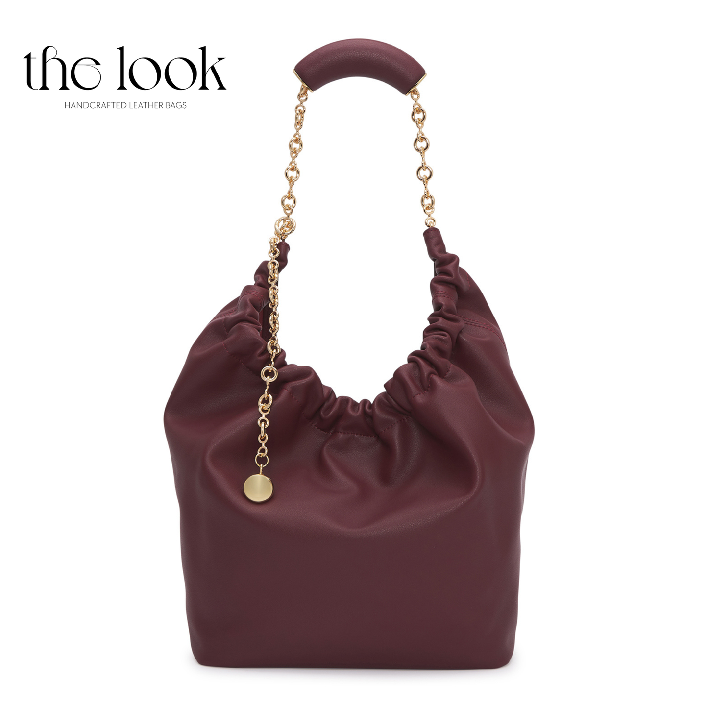 Maroon handbag with gold chain handle and accents on a white background, branded 'the look'. | The Look Officiel
