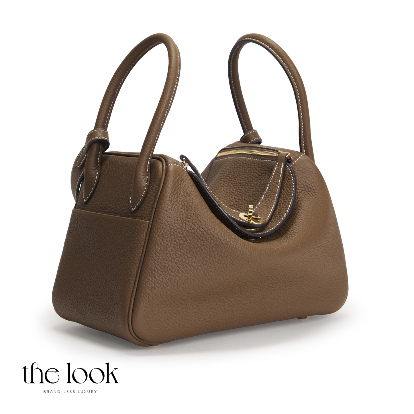Brown handbag on a white background with 'the look' branding. | The Look Officiel
