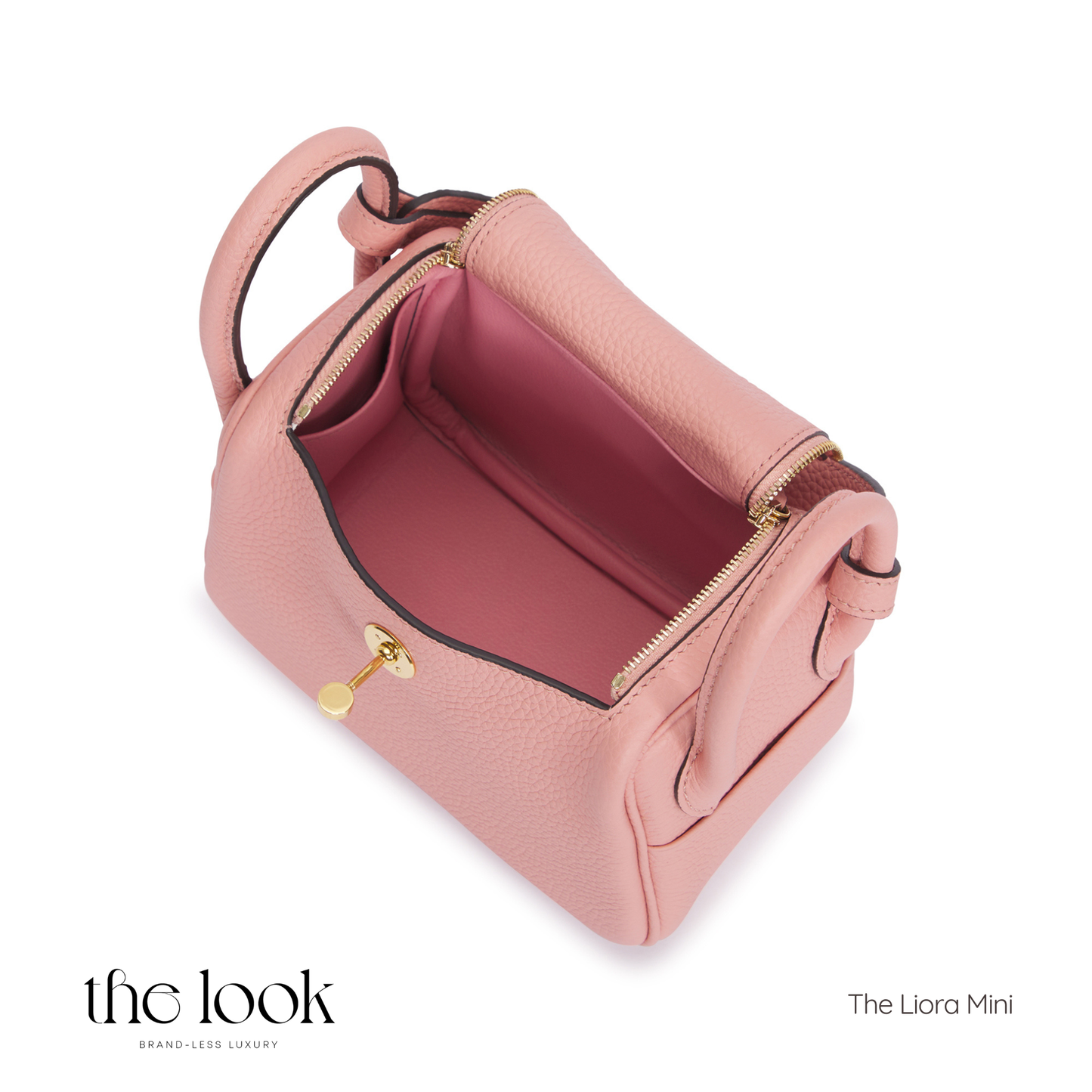 Pink handbag with gold zipper on a white background, featuring 'the look' brand. | The Look Officiel
