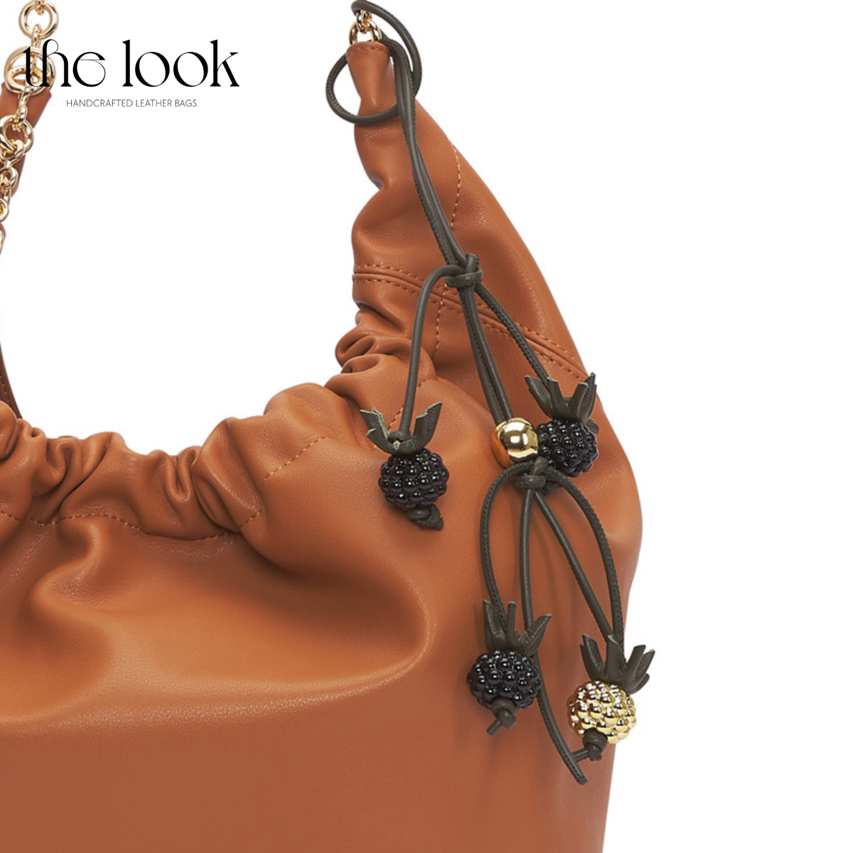 Blackberry Leather Bag Charm on Gold Tan Handbag | The Look Officiel
