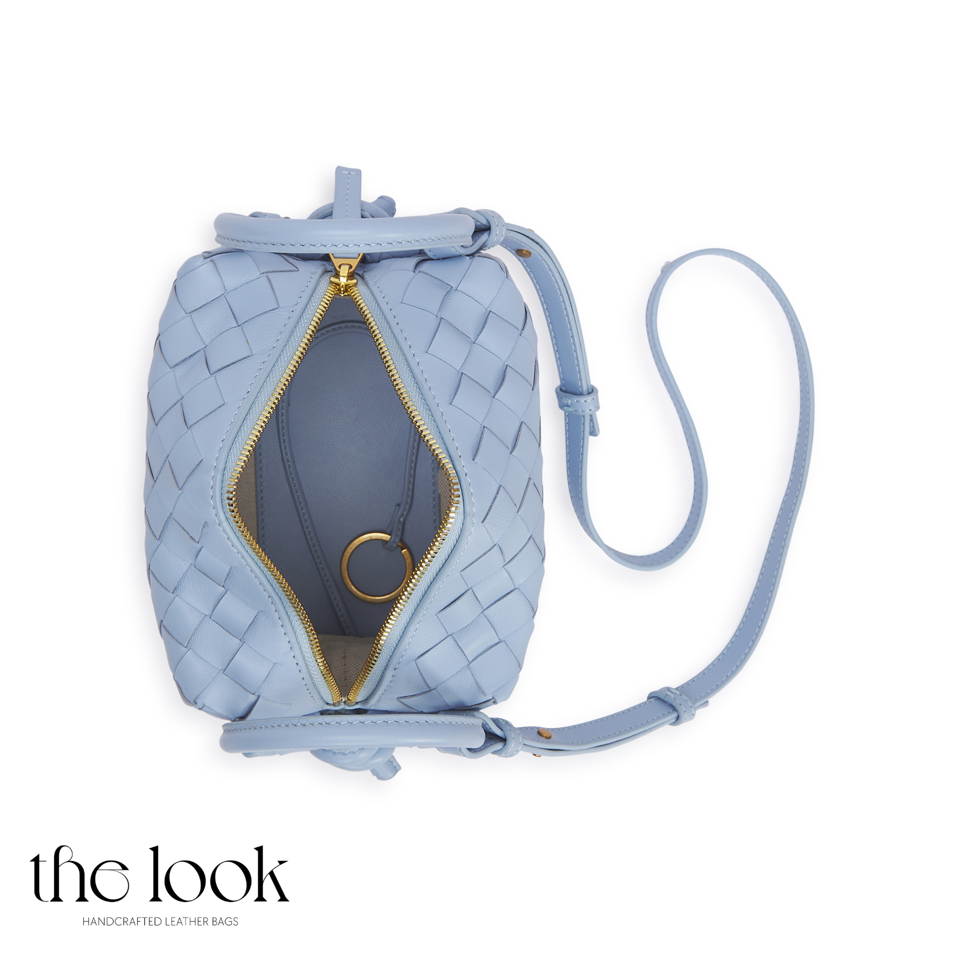 The Loop Two-Way Crossbody, Elité Edition — genuine leather handbag, held | The Look Officiel
