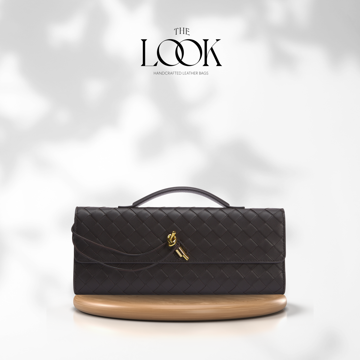 Black quilted handbag with beige bottom section on a white background, featuring 'The Look' brand. | The Look Officiel