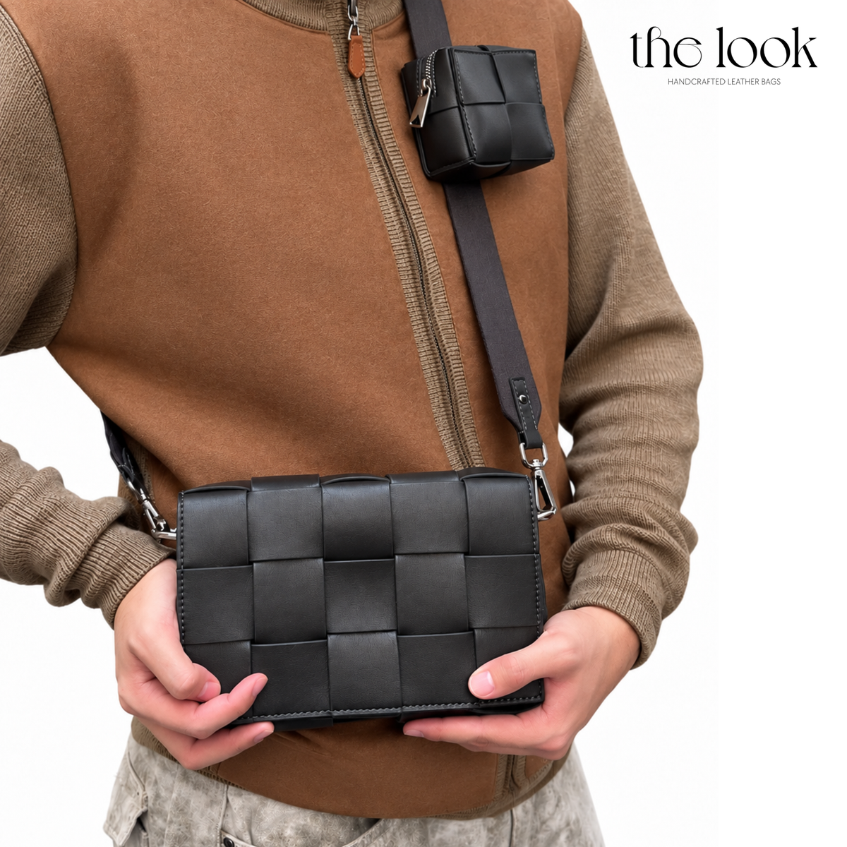 Man wearing black Loop Grid Extra leather crossbody bag with attached zippered pouch on shoulder strap | The Look Officiel