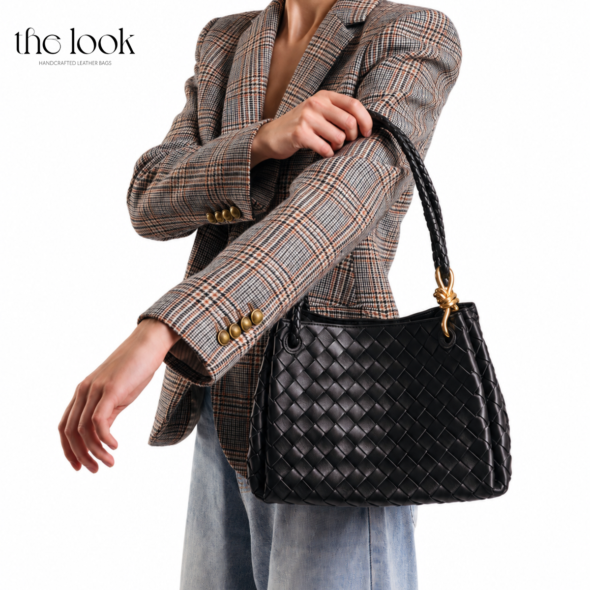 Black The Loop Medium Parachute Convertible Shoulder Bag woven lambskin leather bag carried by hand with a plaid blazer | The Look Officiel