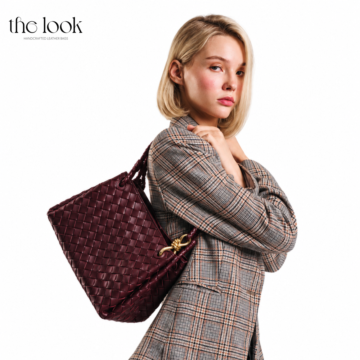 Burgundy The Loop Medium Parachute Convertible Shoulder Bag woven lambskin leather bag styled over the shoulder with a plaid blazer | The Look Officiel
