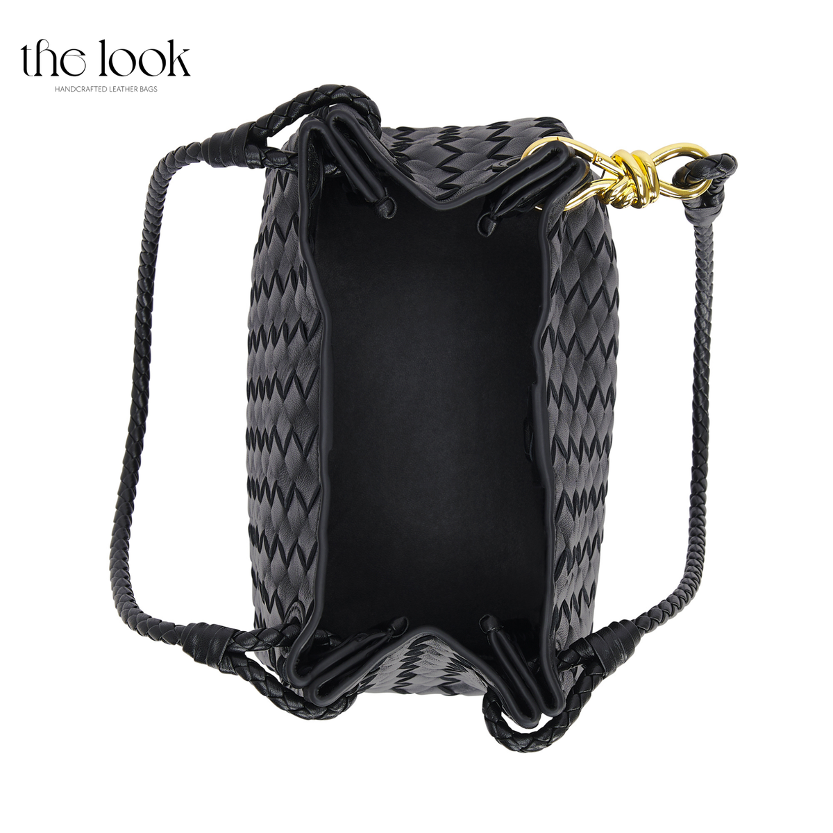 Black The Loop Medium Parachute Convertible Shoulder Bag leather bag top view showing roomy main compartment and woven leather construction | The Look Officiel