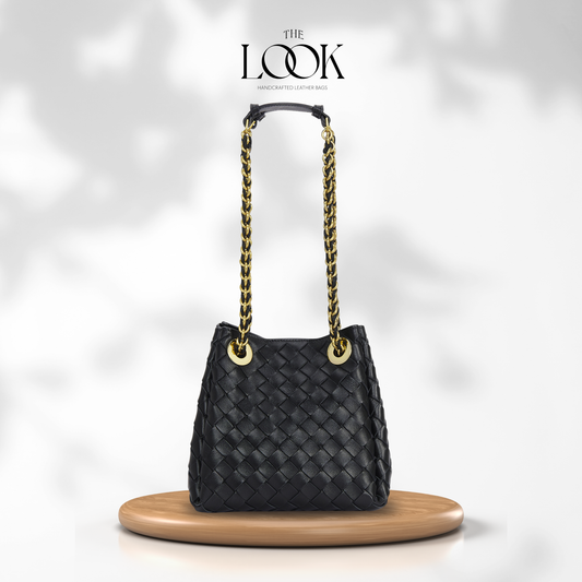 The Loop Small Chain Parachute Convertible Crossbody in black woven lambskin leather with gold-toned chain strap, front view | The Look Officiel