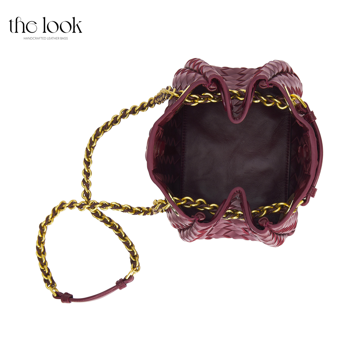 The Loop Small Chain Parachute Convertible Crossbody in burgundy, overhead view showing open main compartment and gold-toned chain strap | The Look Officiel