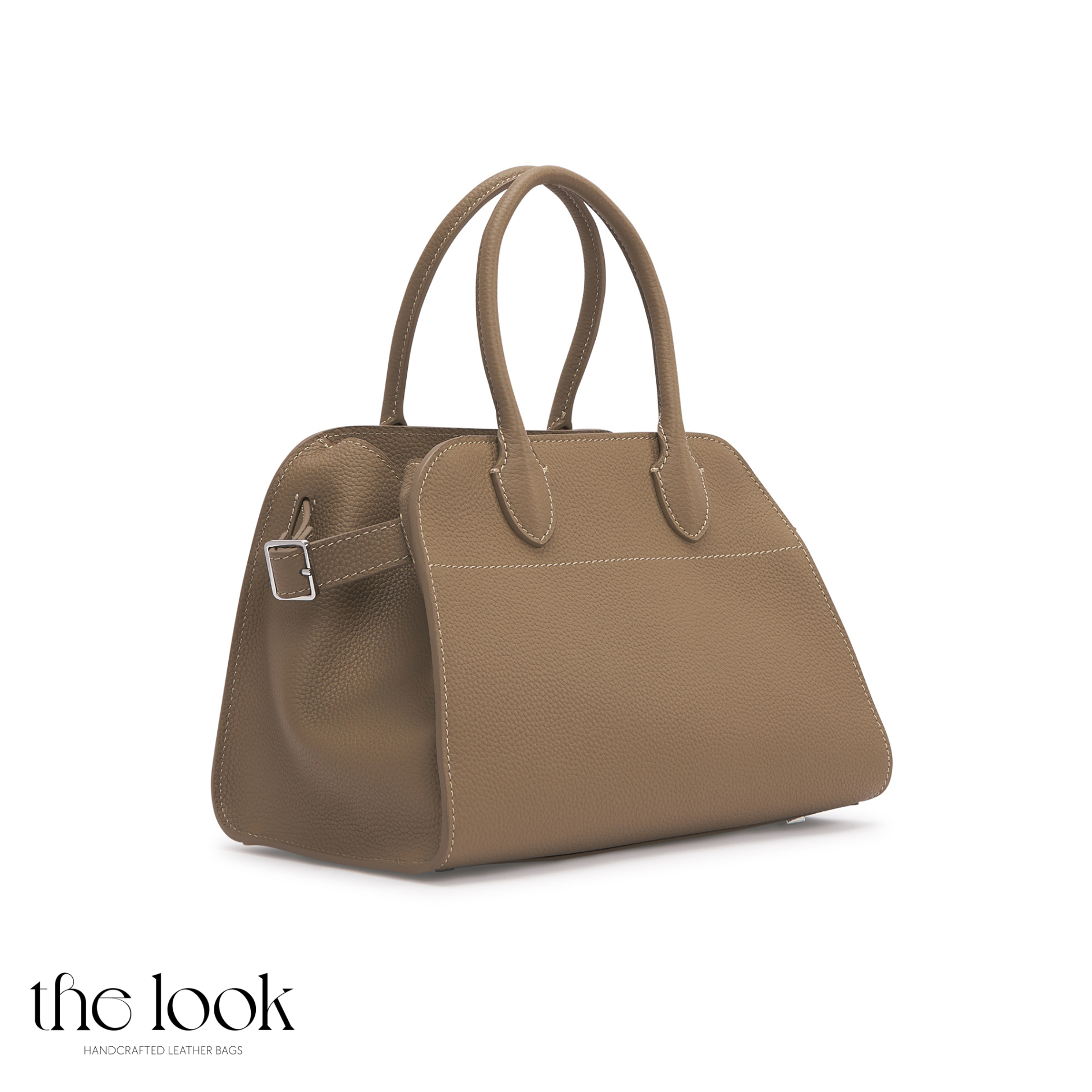 Brown handbag on a white background with 'the look' branding. | The Look Officiel