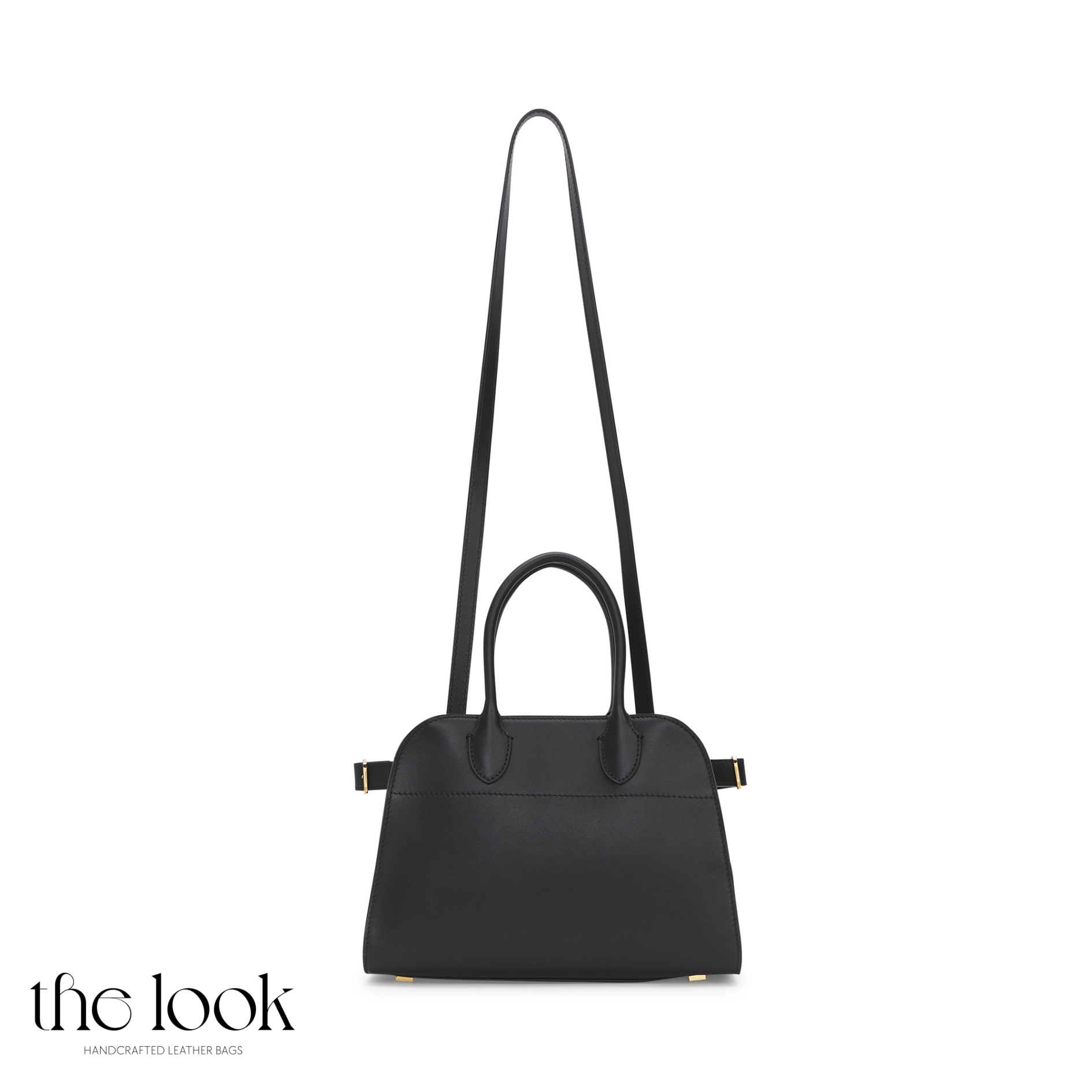 Black handbag with a long strap on a white background, featuring 'the look' brand. | The Look Officiel