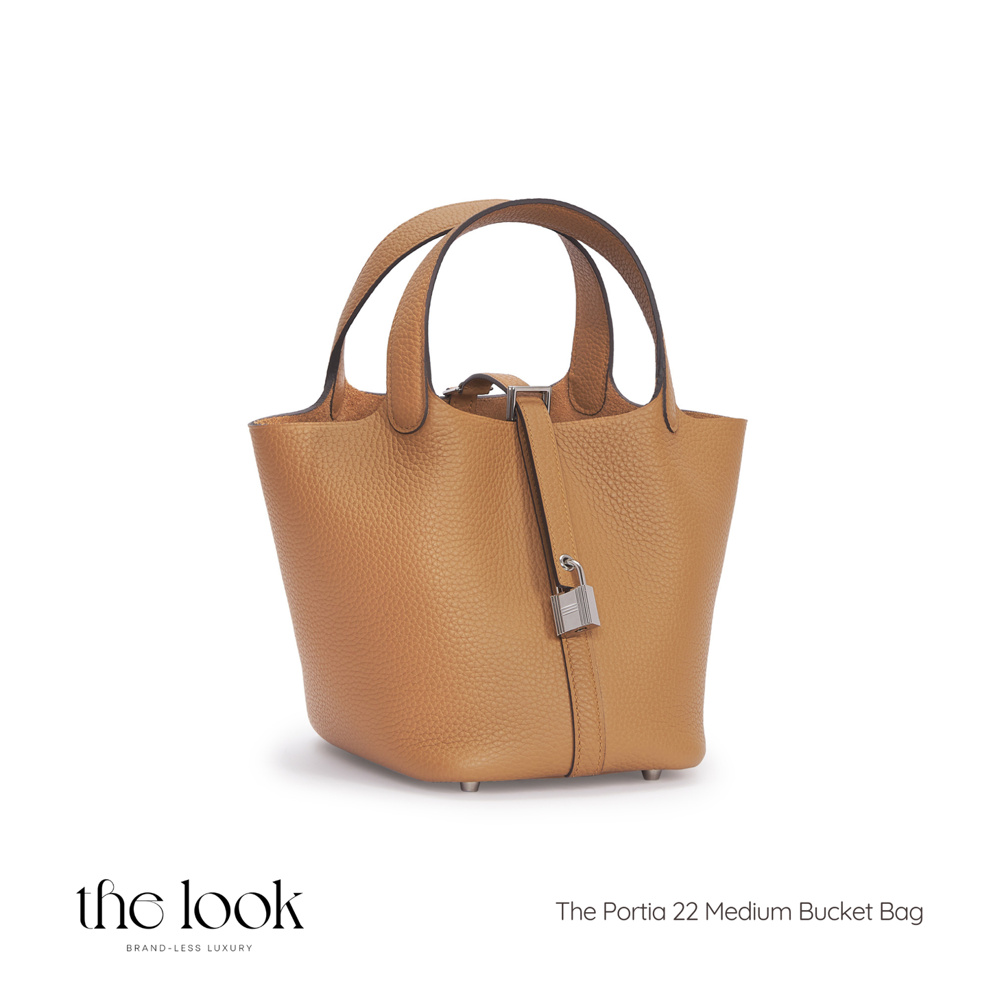 Tan leather handbag with a silver lock on a white background, branded 'the look'. | The Look Officiel