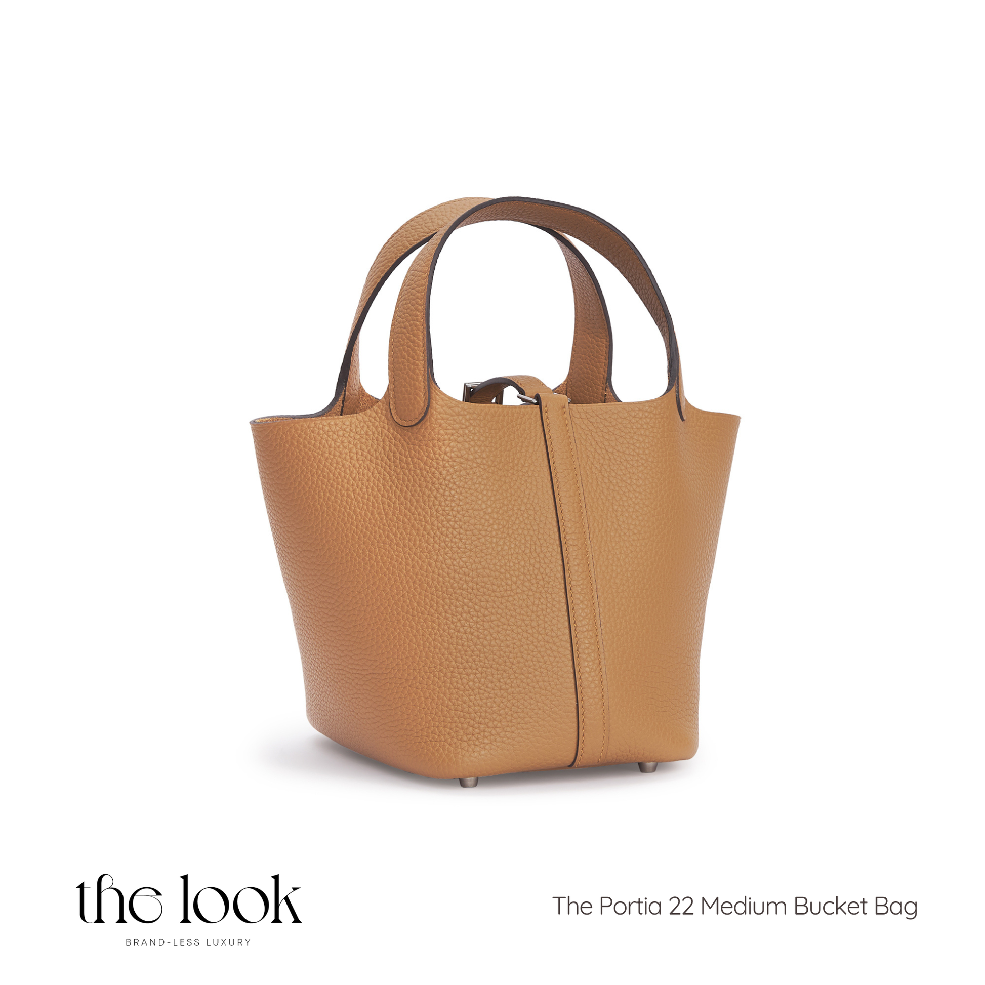 Tan leather bucket bag on a white background with 'the look' branding. | The Look Officiel