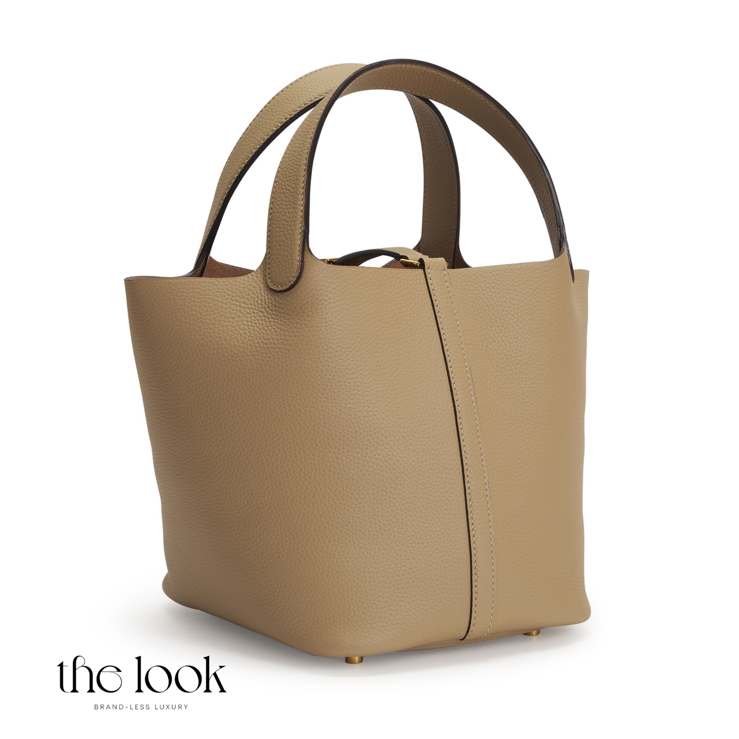 Beige handbag with brown handles on a white background, featuring 'the look' brand. | The Look Officiel