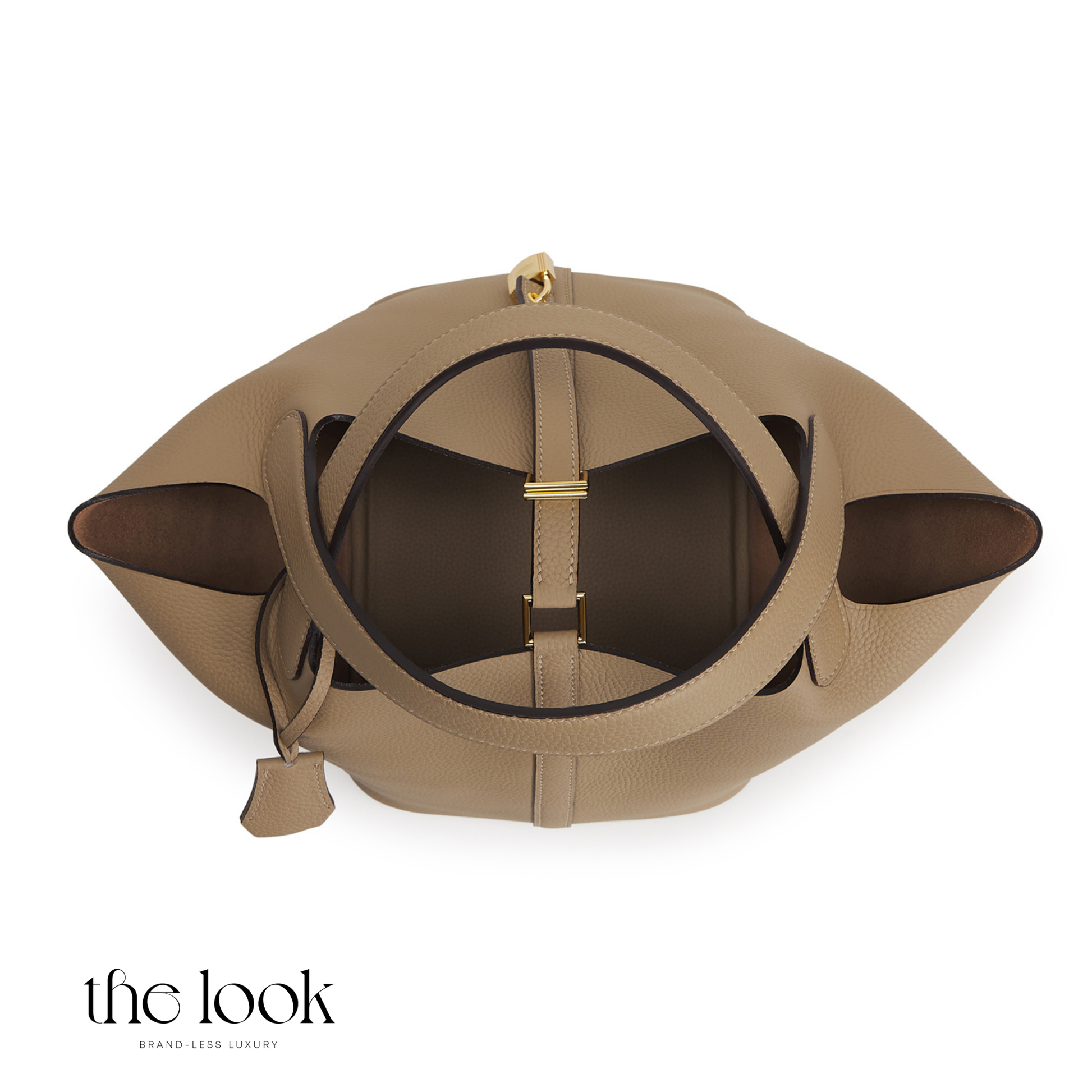 Tan leather handbag with gold accents on a white background, featuring 'the look' brand. | The Look Officiel