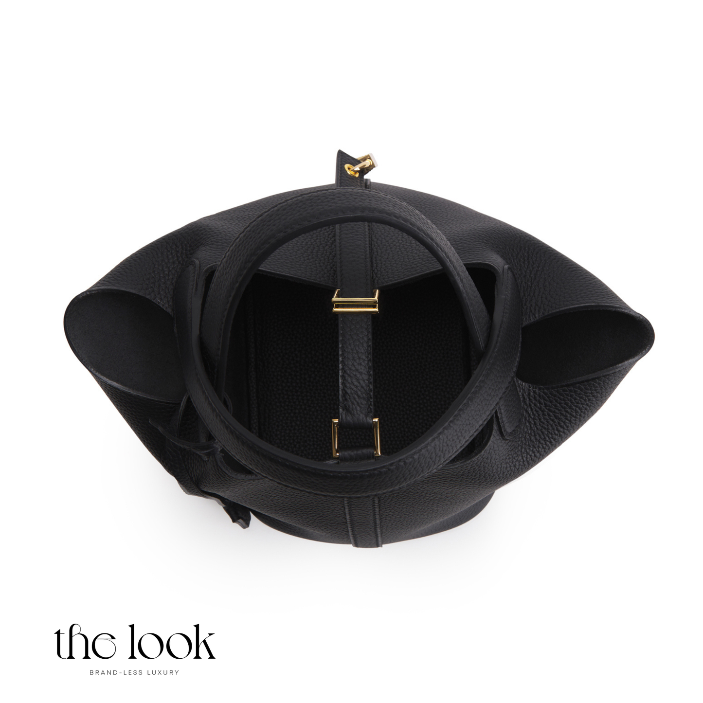 Black leather handbag with gold accents on a white background, branded 'the look'. | The Look Officiel