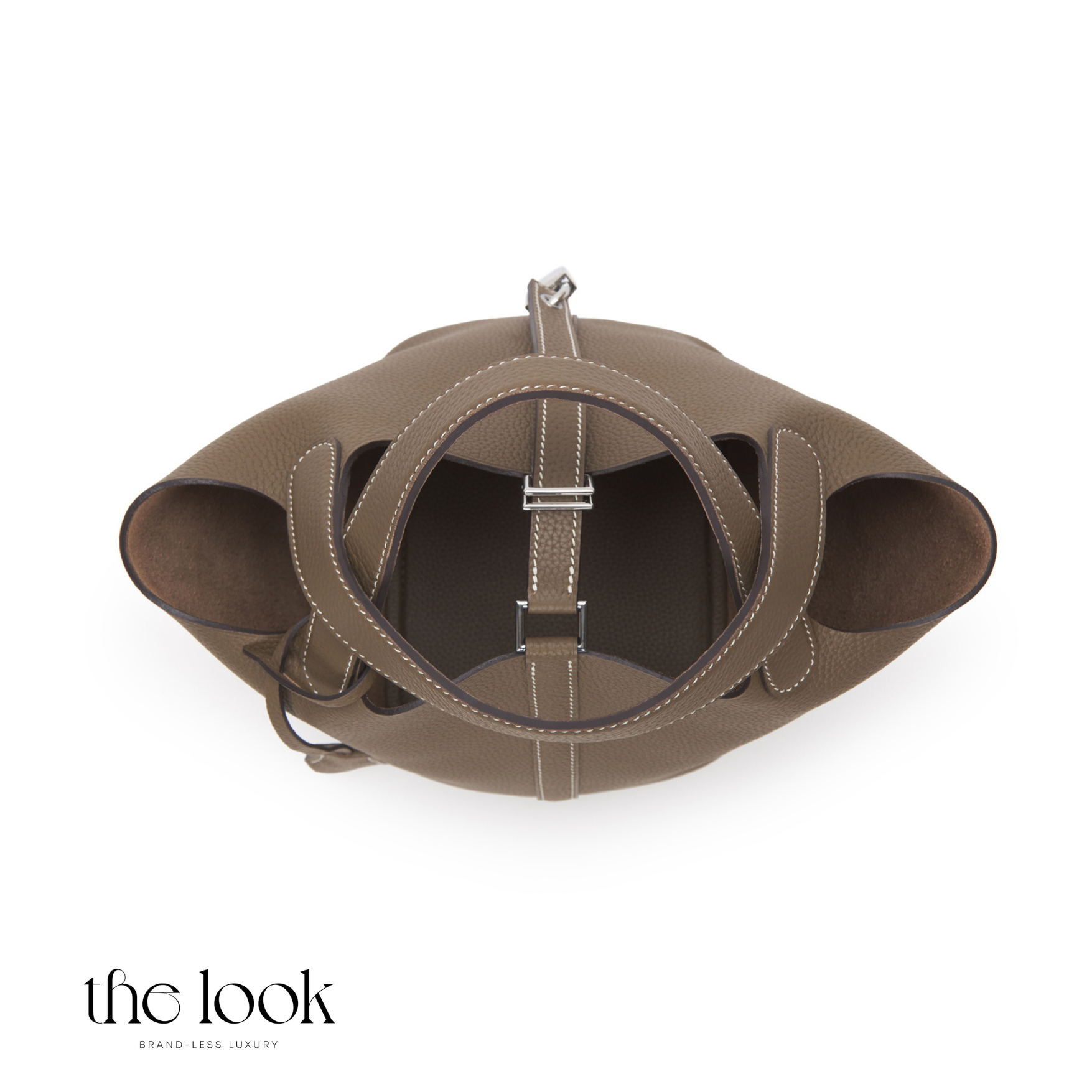 Brown leather handbag with circular design on a white background | The Look Officiel