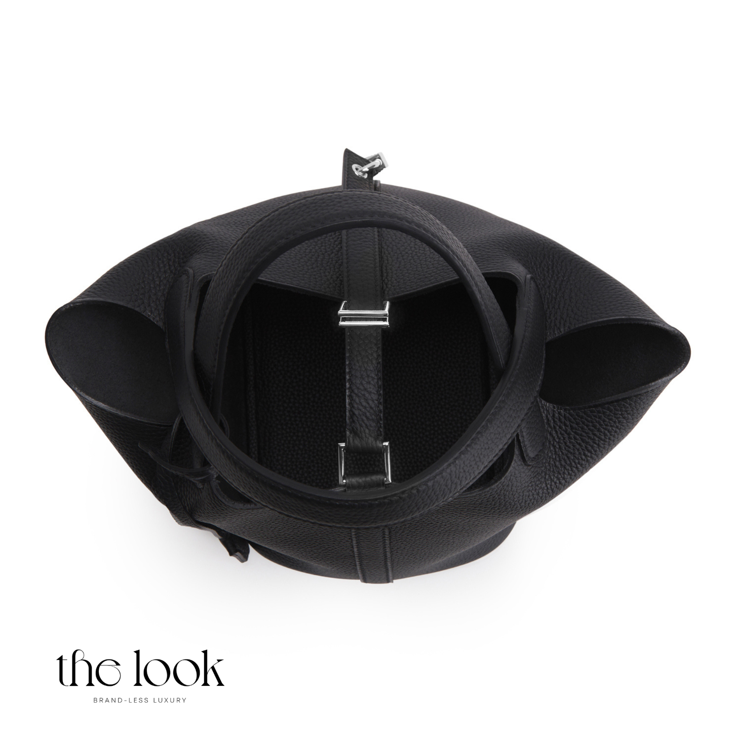 Black leather bag with a circular design on a white background, featuring 'the look' brand. | The Look Officiel