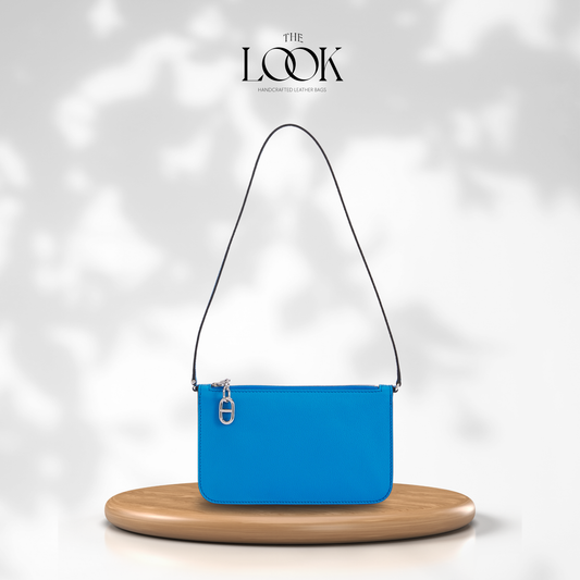 Denim Blue Pochette Three-Way Bag in top-grain pebbled calfskin leather with silver stainless steel hardware, front view as a shoulder bag