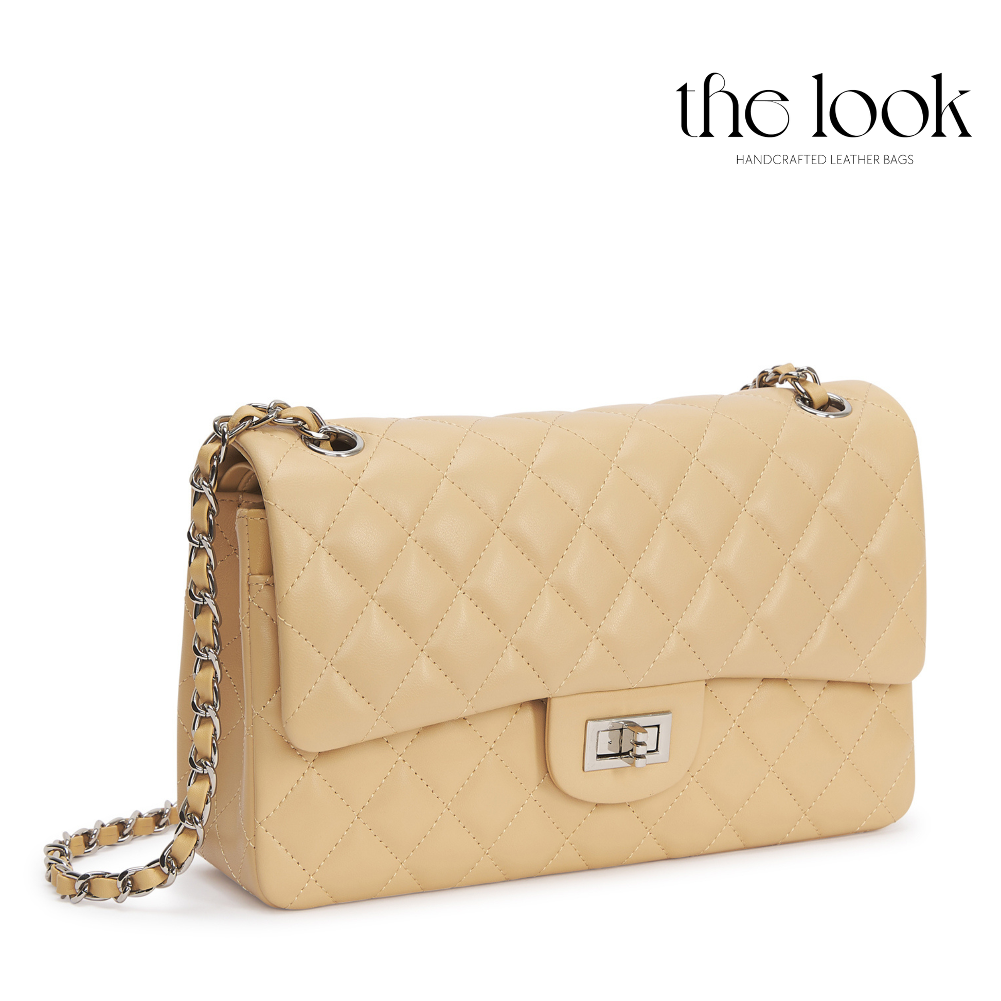 Beige quilted handbag with a chain detail on a white background, featuring 'the look' brand. | The Look Officiel