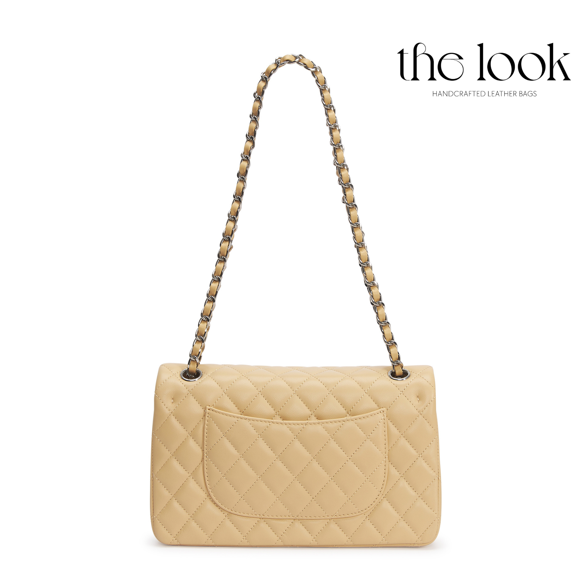 Beige quilted handbag with a chain strap on a white background, featuring 'the look' brand. | The Look Officiel