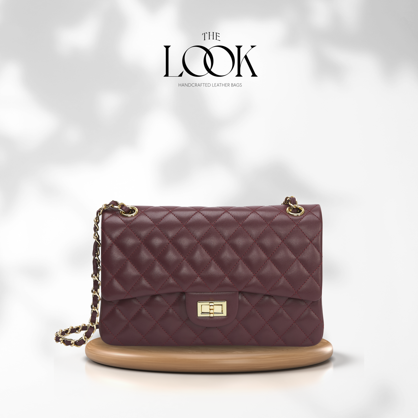 Quilted purple handbag with gold chain on a white background, featuring 'The Look' brand. | The Look Officiel