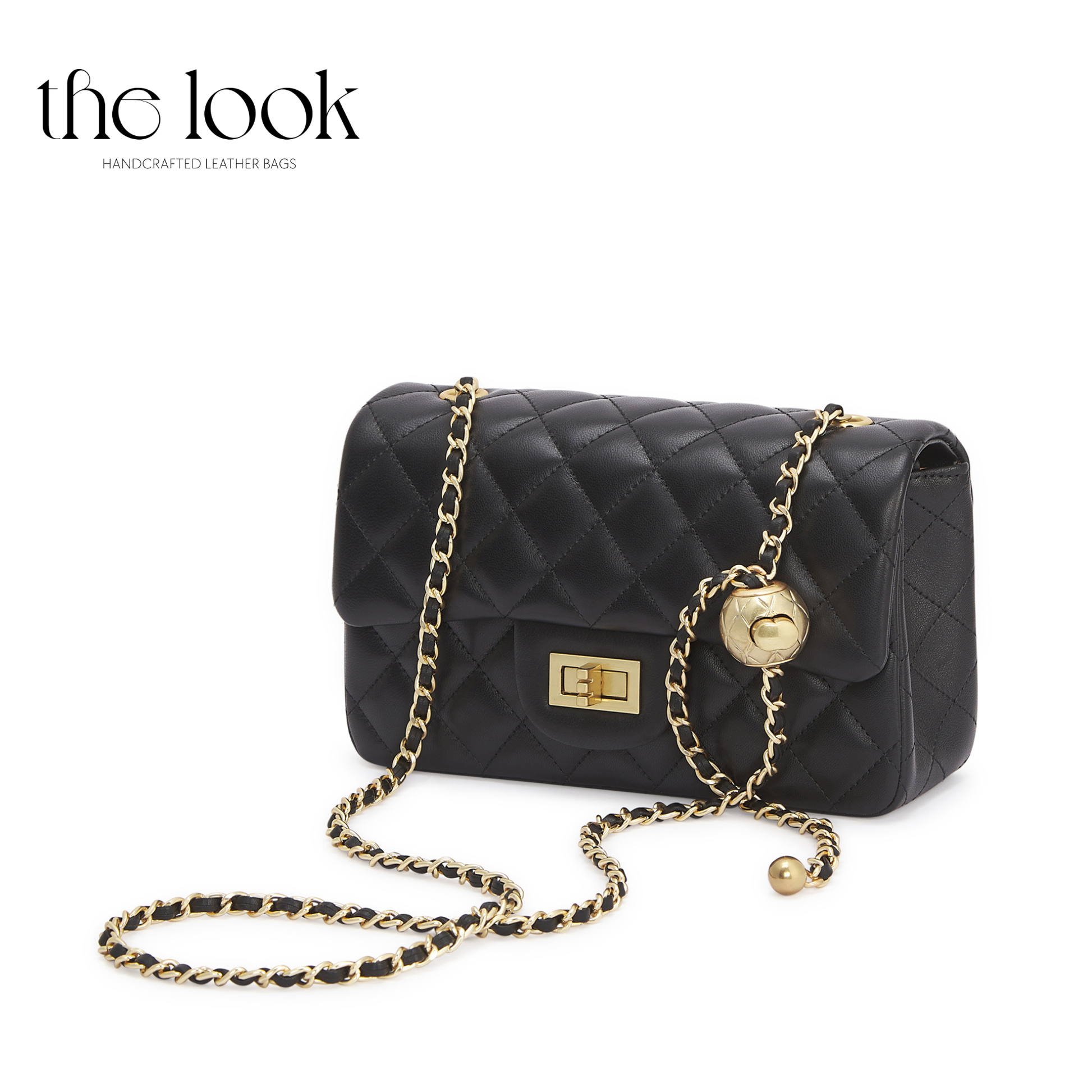 Black quilted handbag with gold chain strap on a white background, branded 'the look'. | The Look Officiel